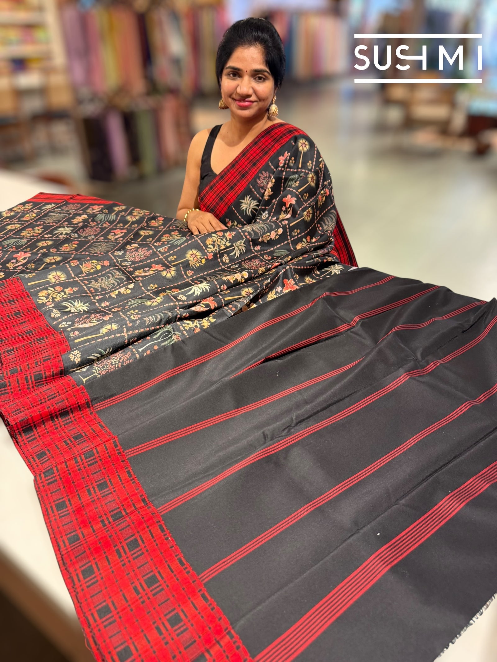 Black printed soft silk saree with burberry checks border : D62F035