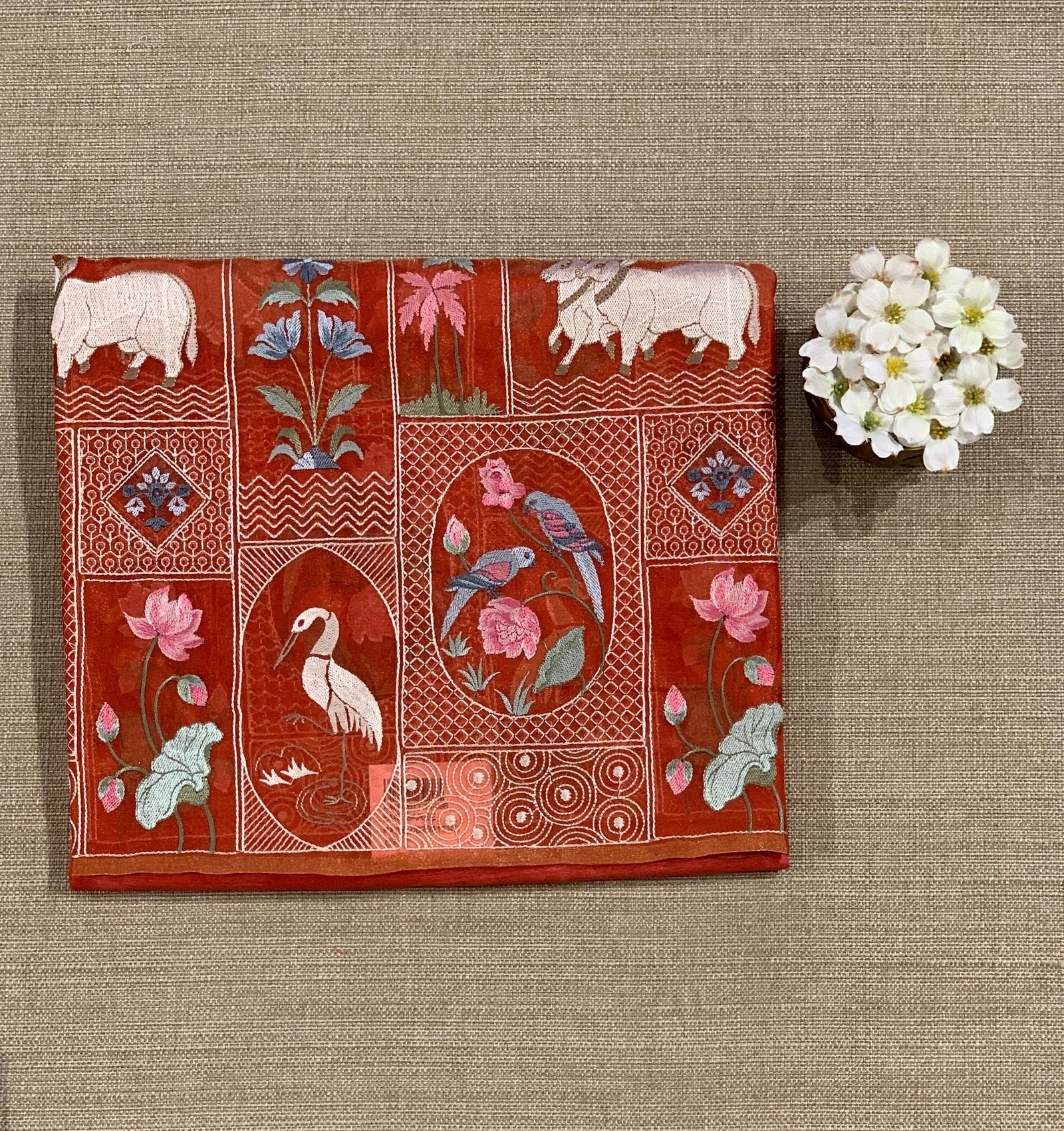 Reddish Orange Kora-Tussar blend Handloom Saree with Tissue embroidered Skirt Border