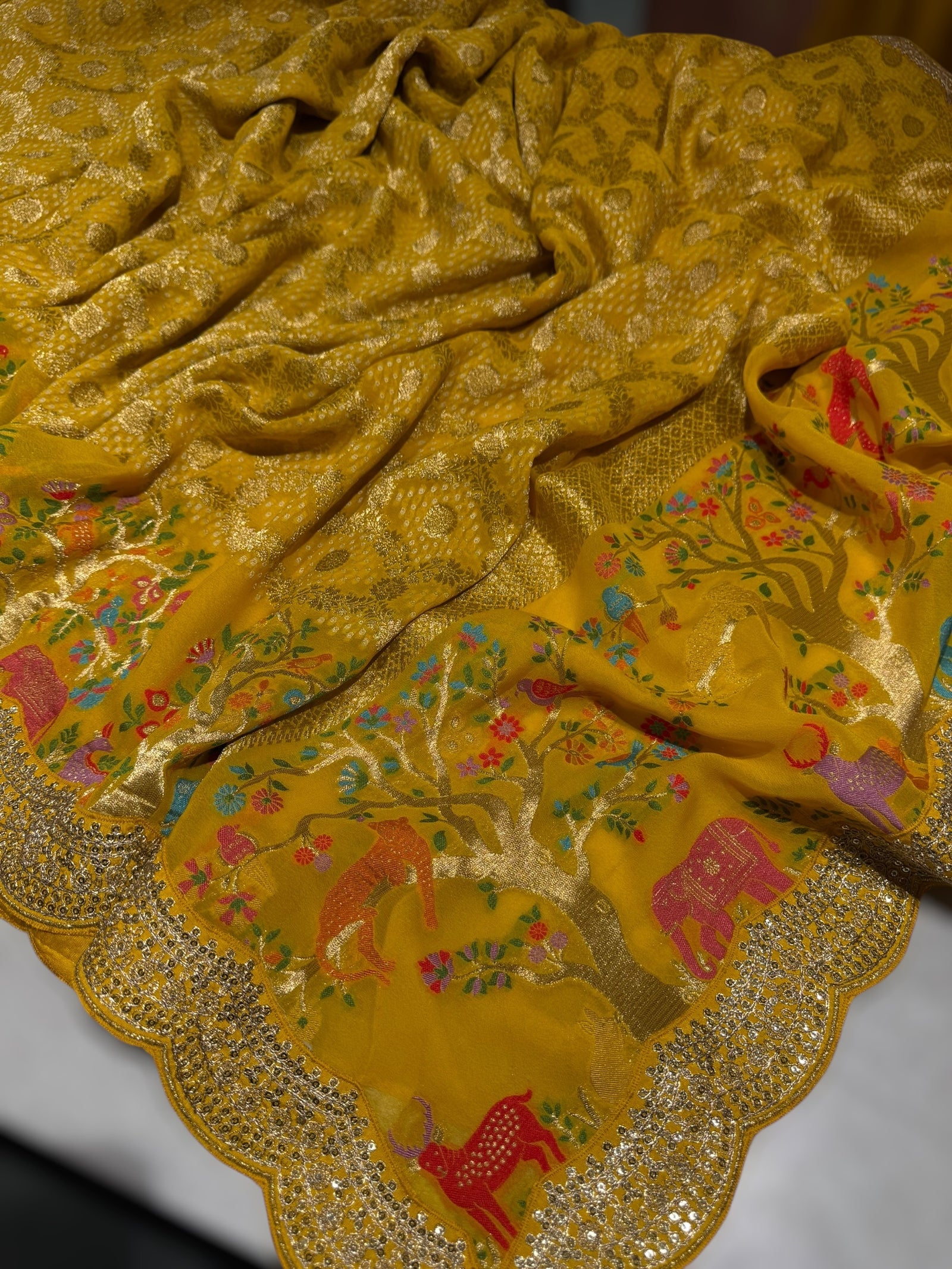 Yellow Bandhini Georgette Saree with sabya style scallop border