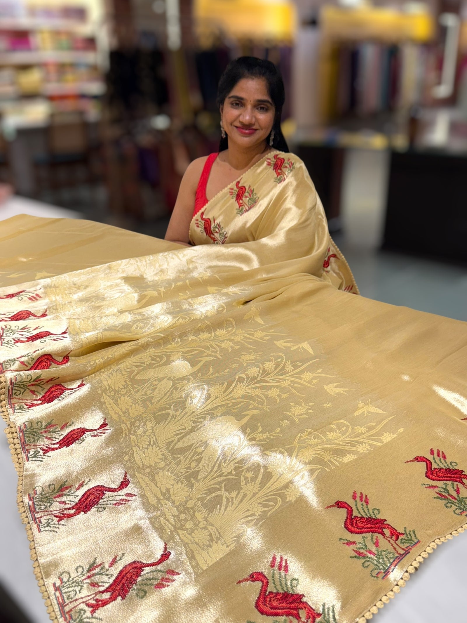 Pastel yellow Banarasi Brocade tissue saree with tonchui style weaving & petite point embroidered swan border