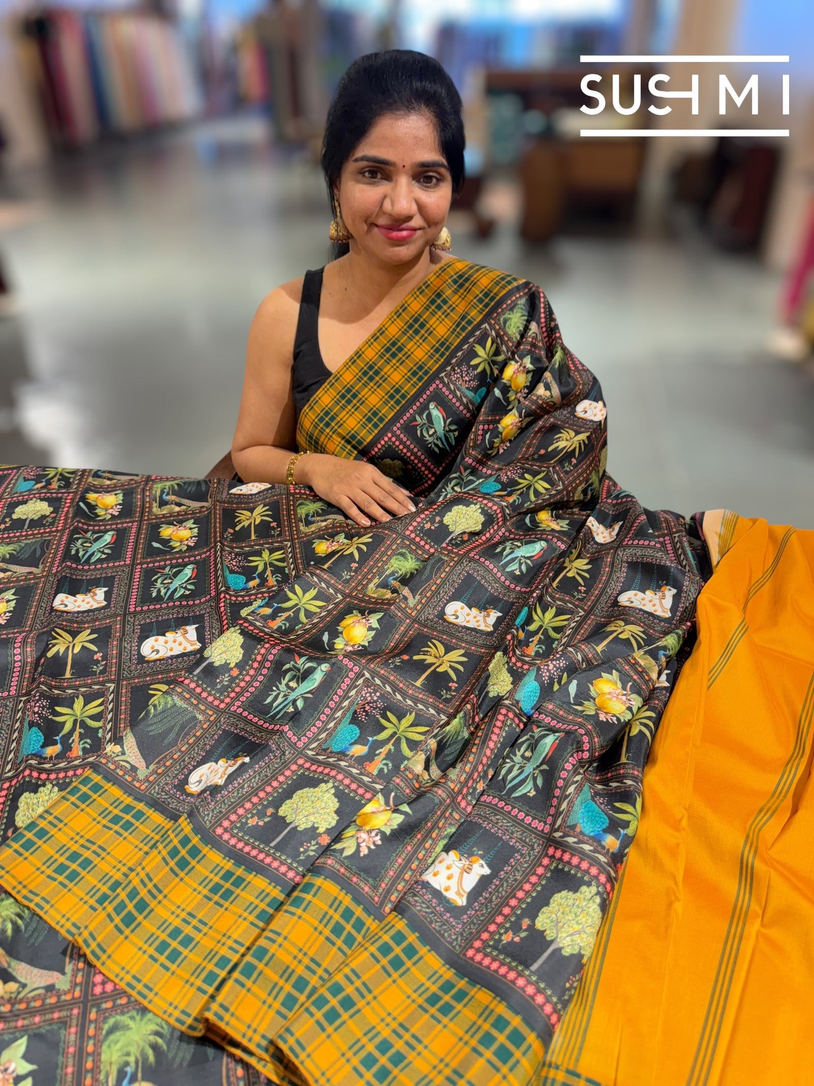 Black printed soft silk saree with burberry checks border : D62F033