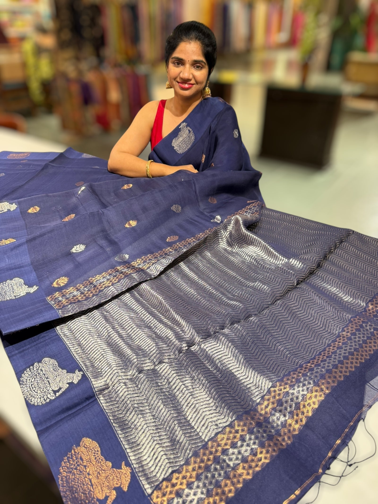 Midnight Blue kora muslin sarees with kaduwa woven nandi motif border