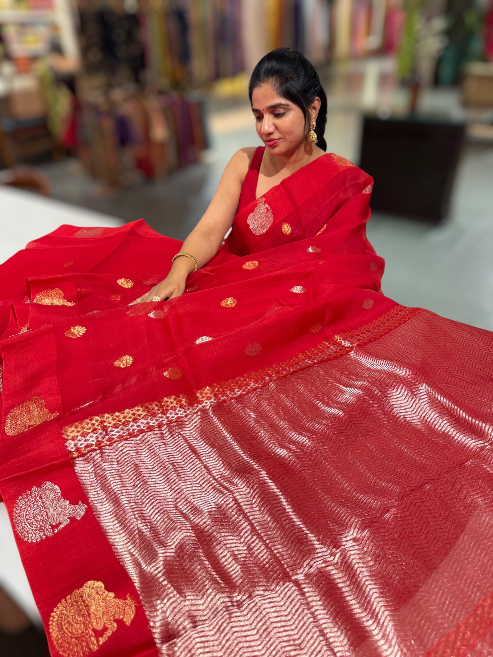 Red kora muslin sarees with kaduwa woven nandi motif border