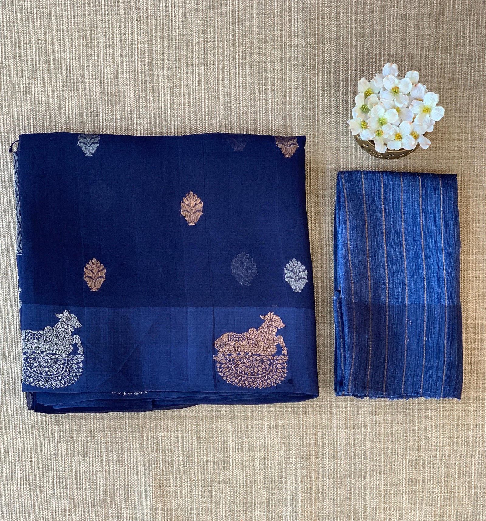 Midnight Blue kora muslin sarees with kaduwa woven nandi motif border