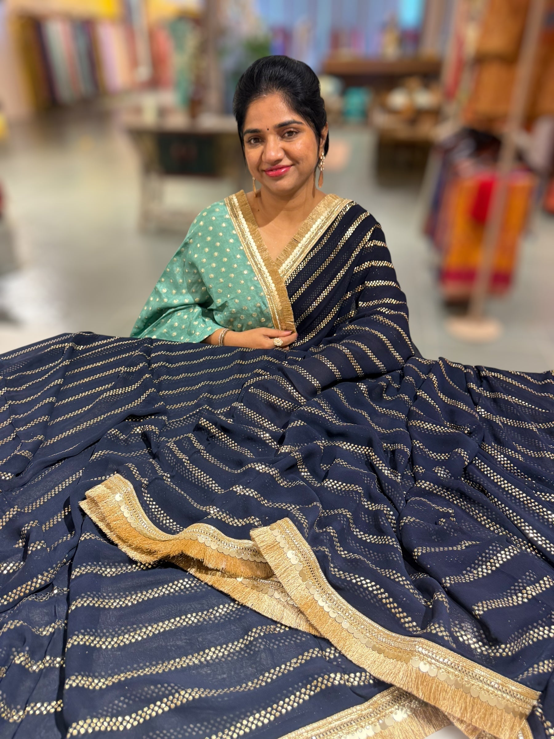 Navy Blue Georgette Saree with stick on Badla in stripes pattern and kiran Lace
