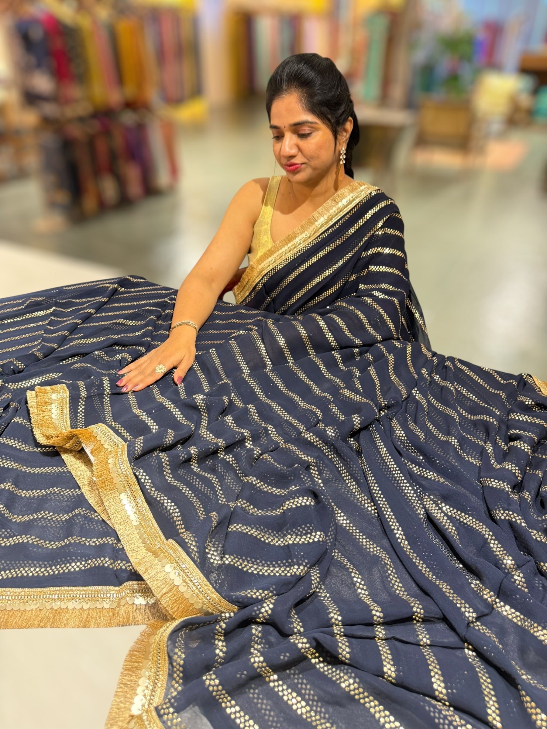 Navy Blue Georgette Saree with stick on Badla in stripes pattern and kiran Lace