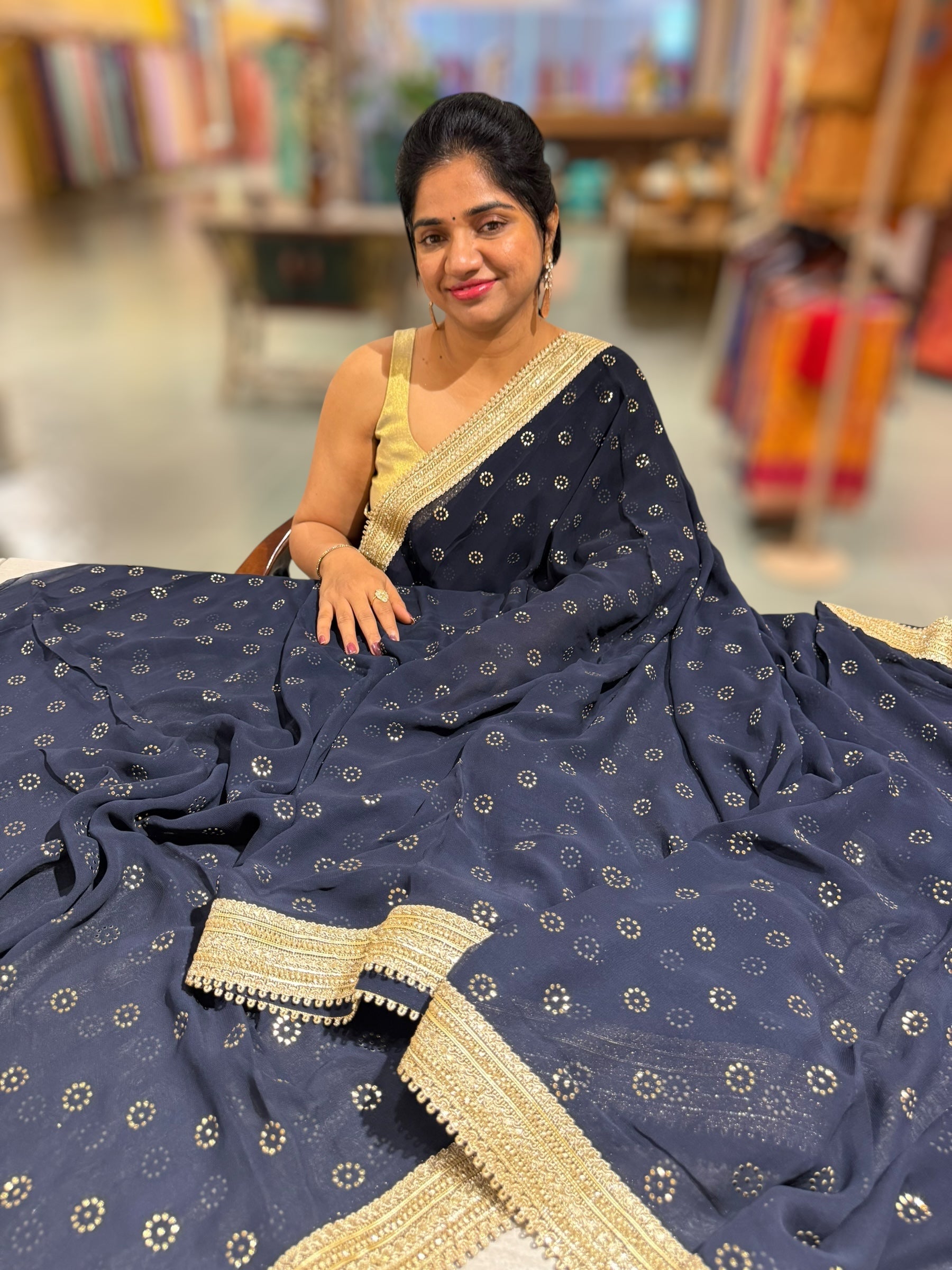 Midnight blue Georgette Saree with stick on Badla in flower pattern