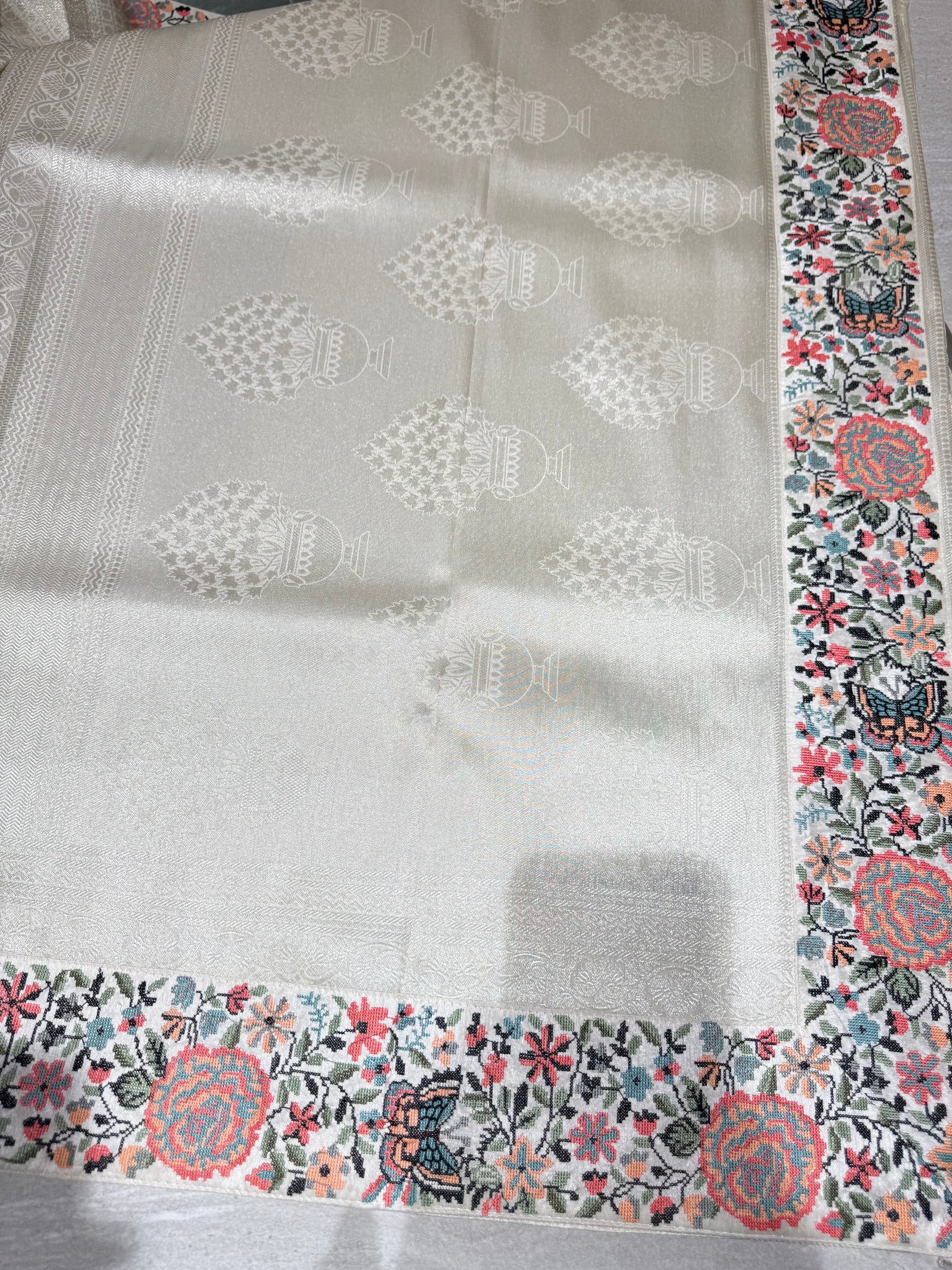 Half White Banarasi  brocade Silk Saree with Petite Point Embroidered Border.