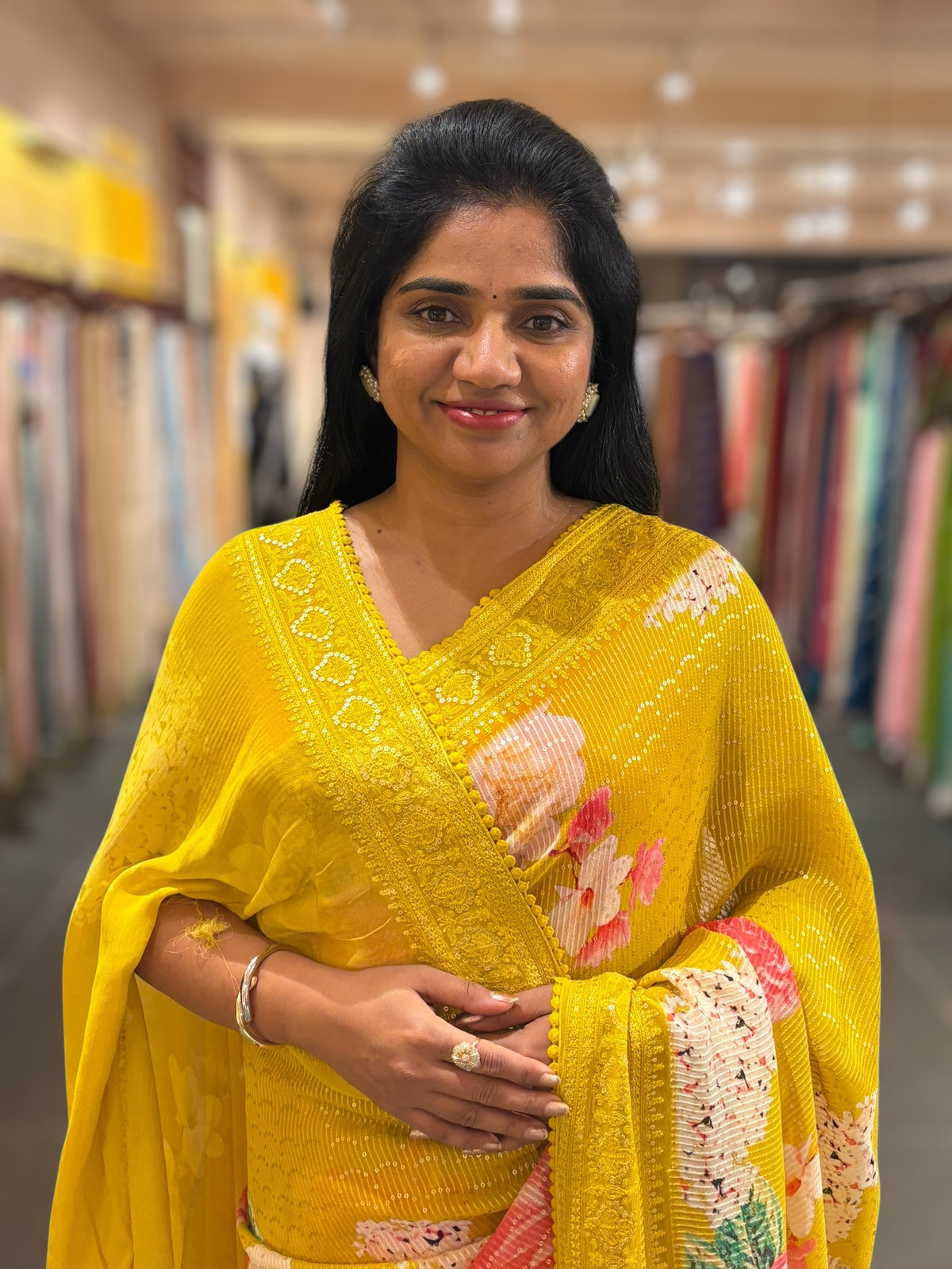 Yellow georgette sequence saree with statement floral print