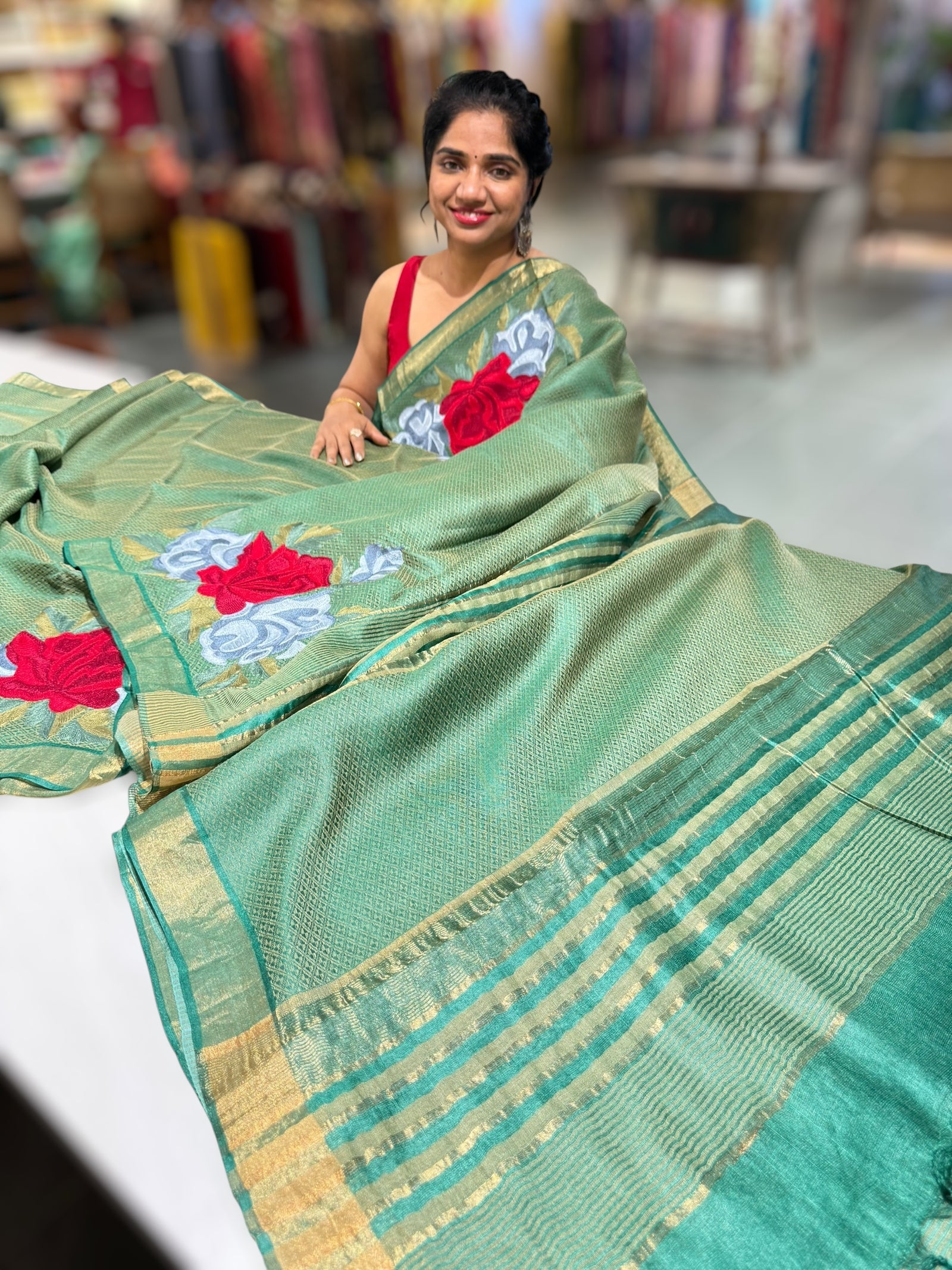 Emerald Green Tussar Brocade Saree With Statement Red Rose Embroidery.