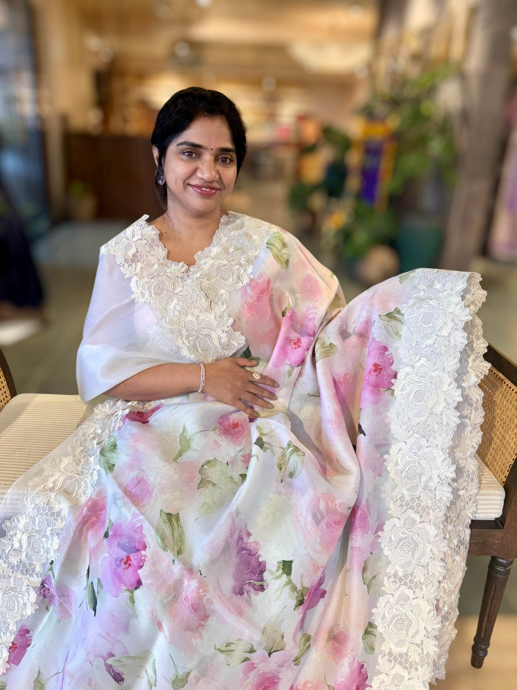 Ivory Printed Organza Saree With Chantilly Lace Style Embroidered Border.