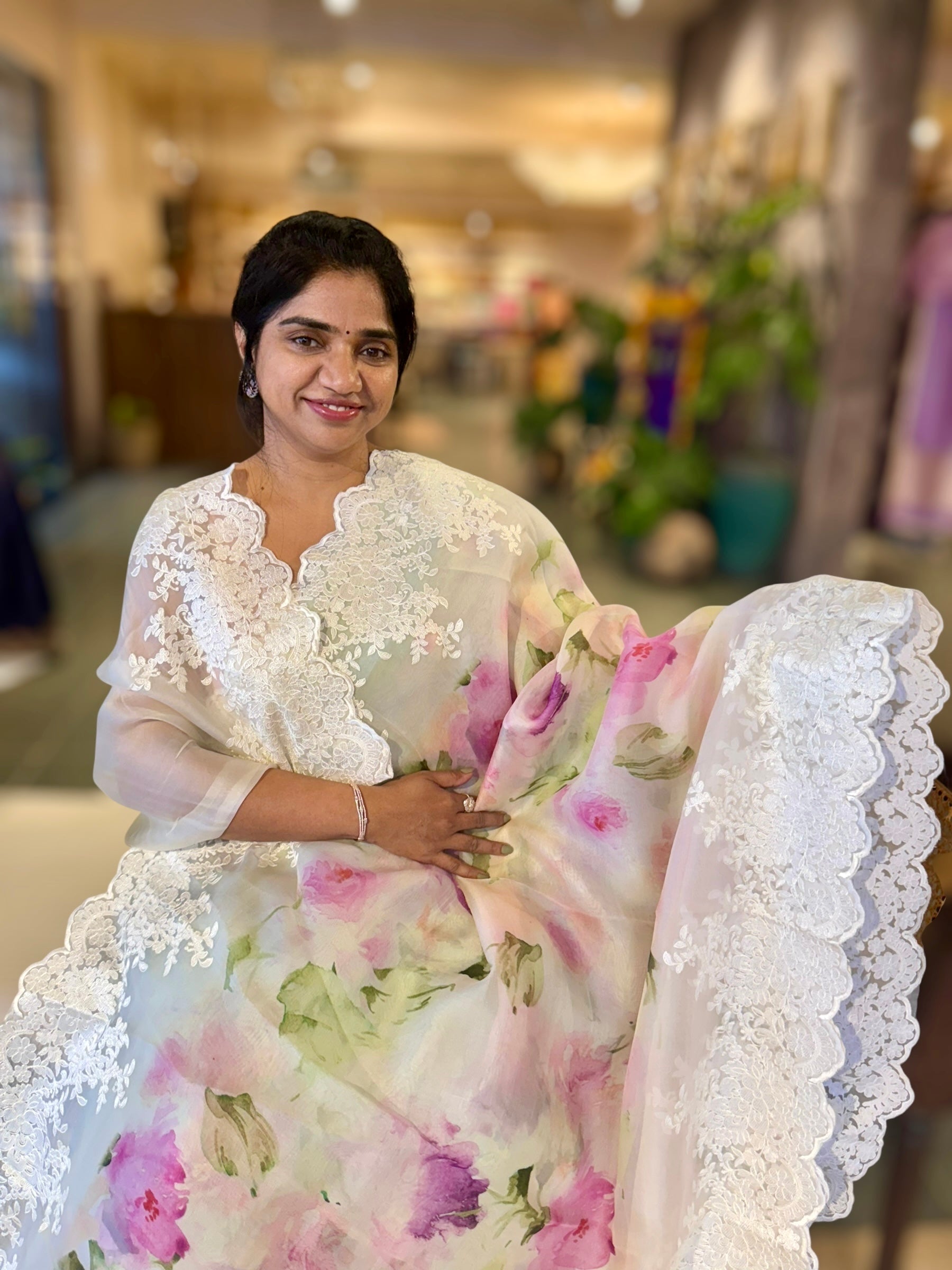 Ivory Printed Organza Saree With Chantilly Lace Style Embroidered Border.