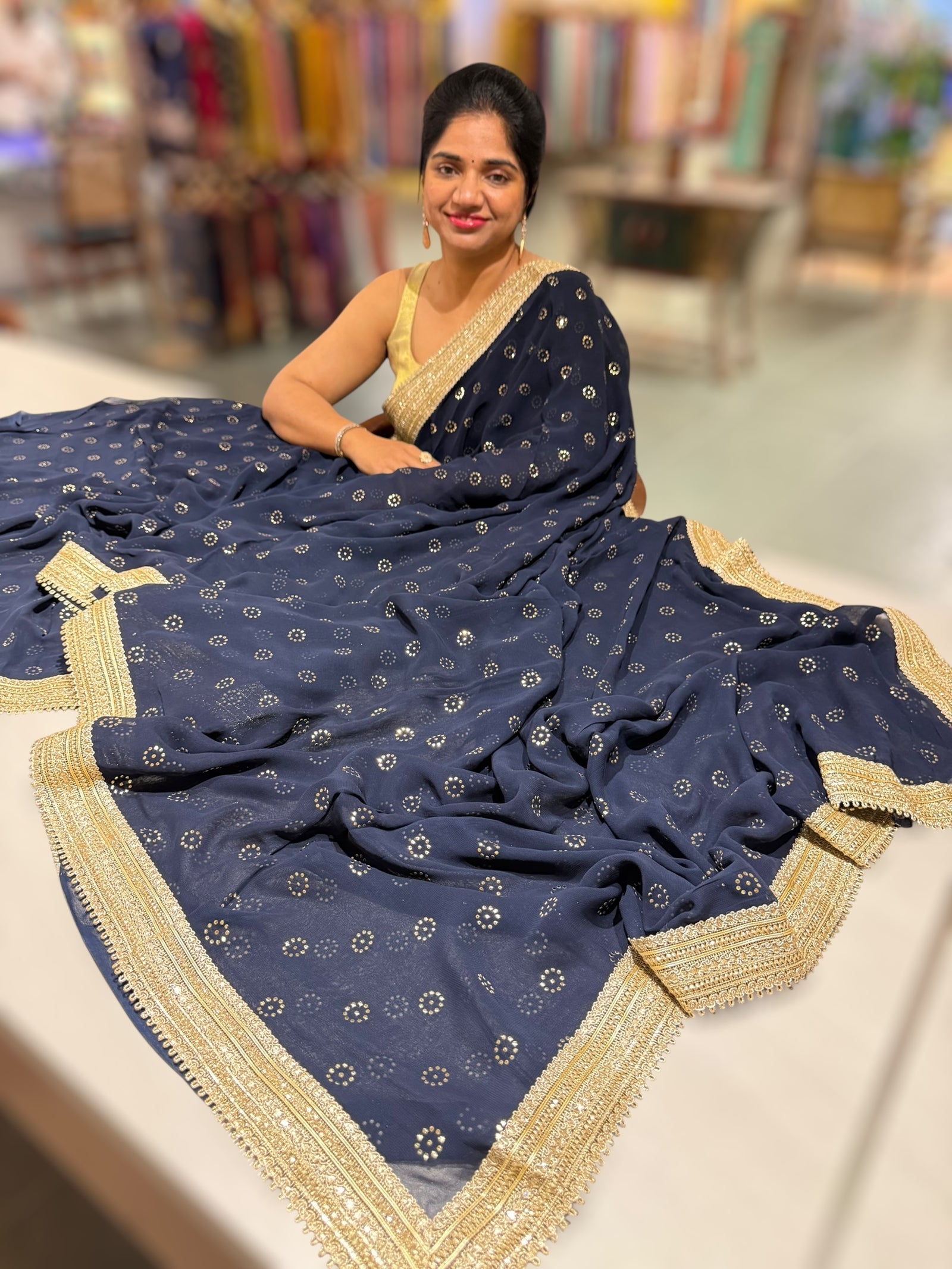 Midnight blue Georgette Saree with stick on Badla in flower pattern