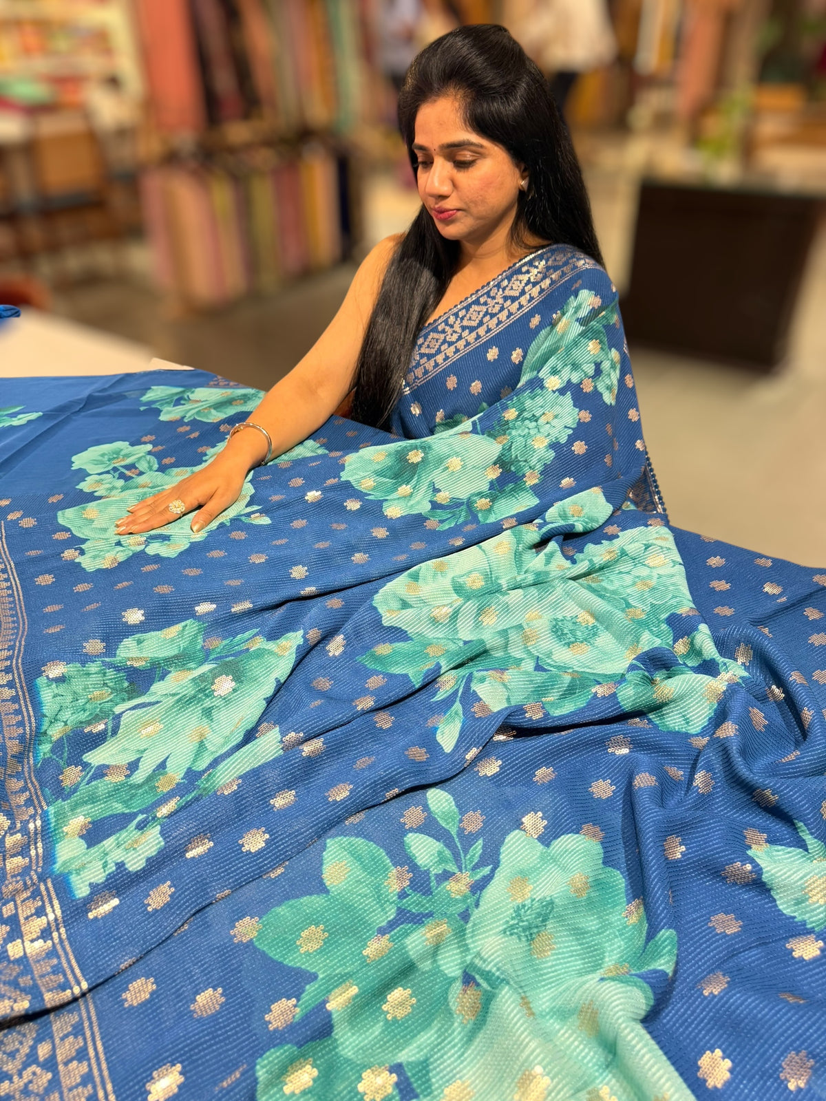 Blue georgette sequence saree with statement floral print