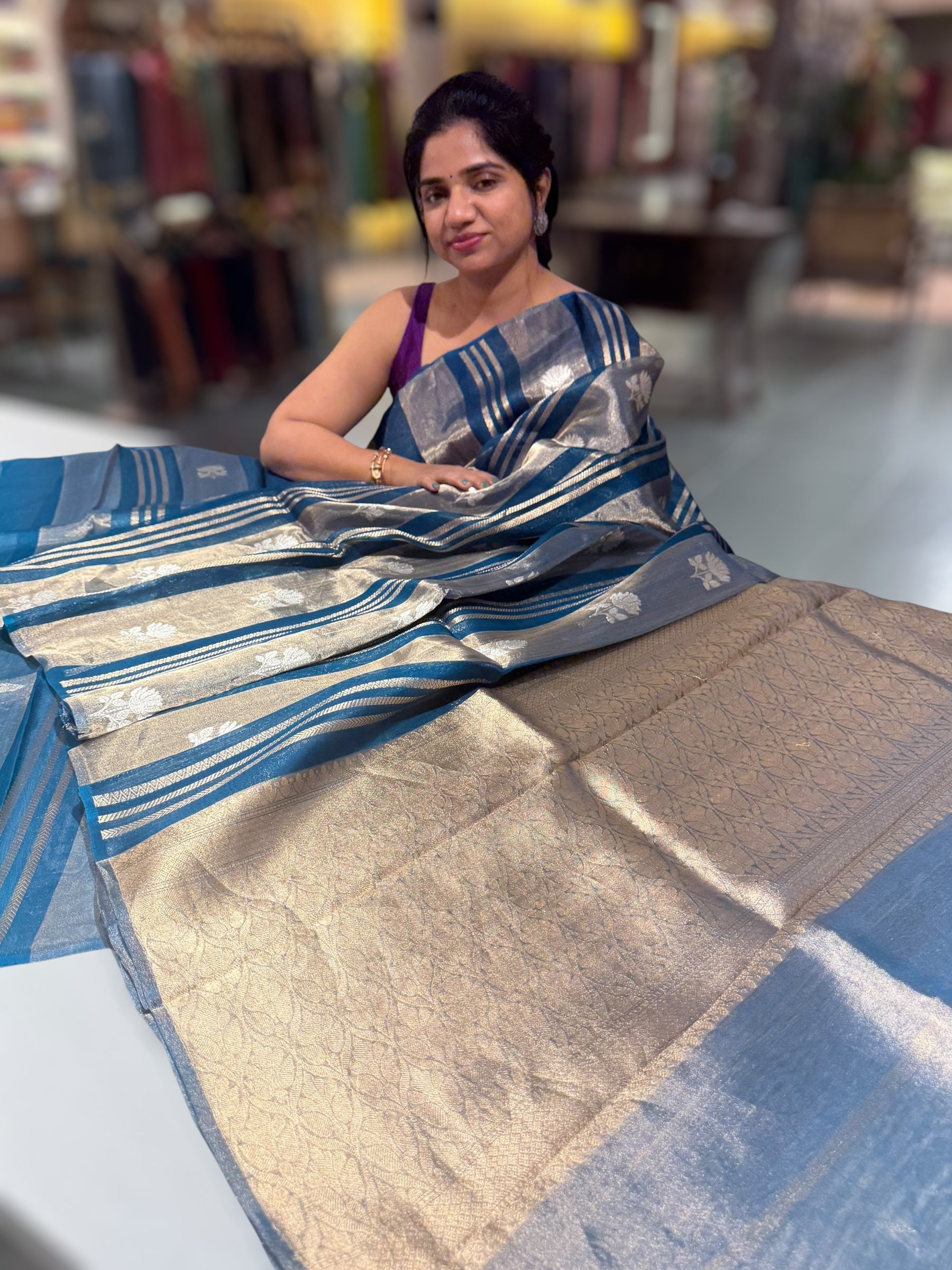Peacock Blue Banarasi Handloom Kora Tissue Stripes with allover kaduwa woven lotus  motifs .
