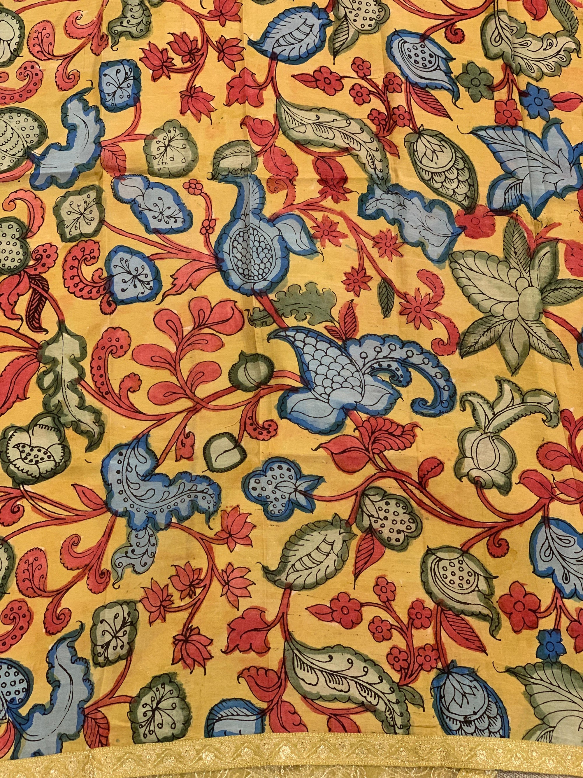 Yellow gold Tissue saree with Allover zari embroidery hemlined with sabyasachi borders & paired with pen kalamkari blouse