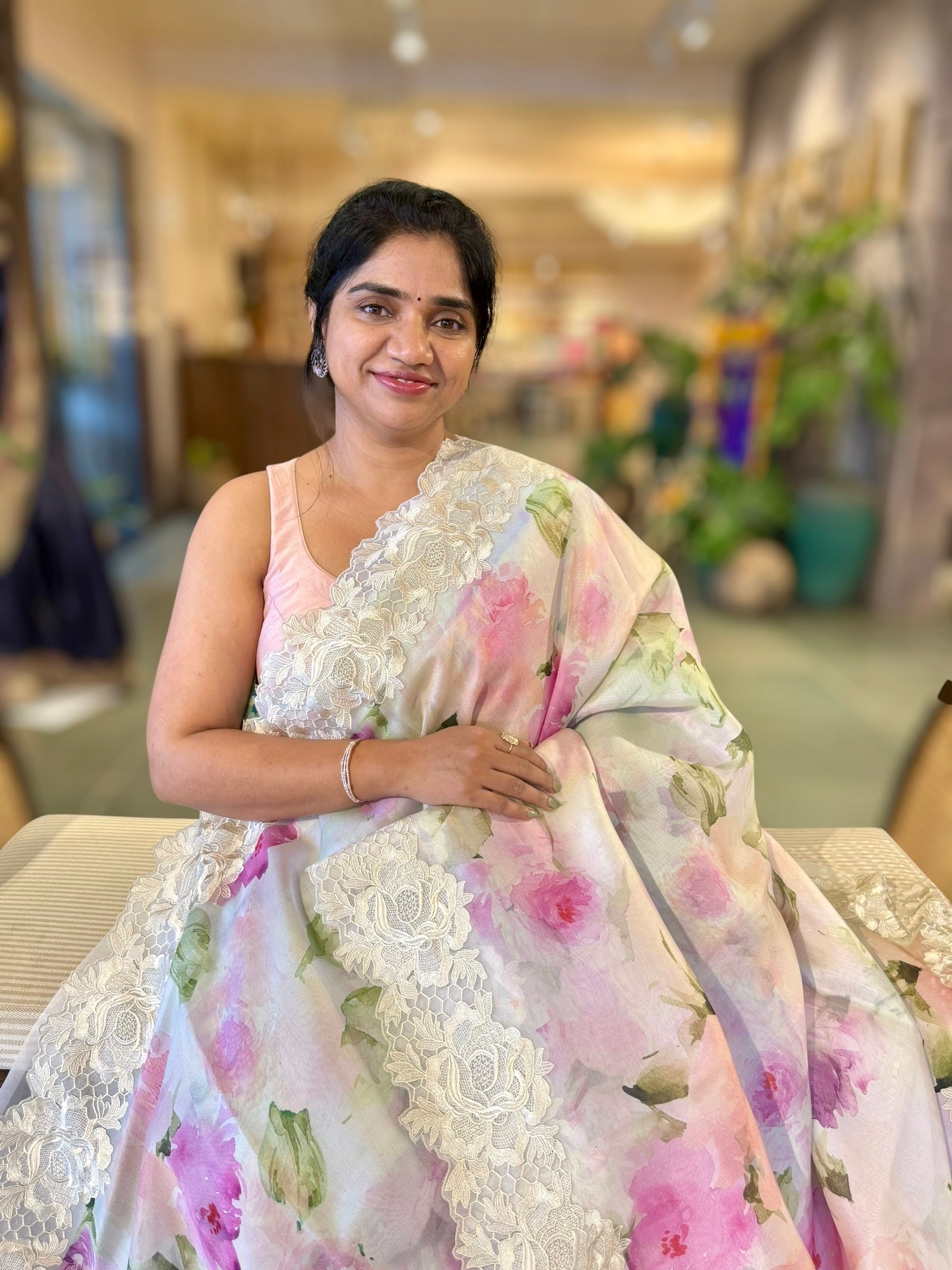 Ivory Printed Organza Saree With Chantilly Lace Style Embroidered Border.