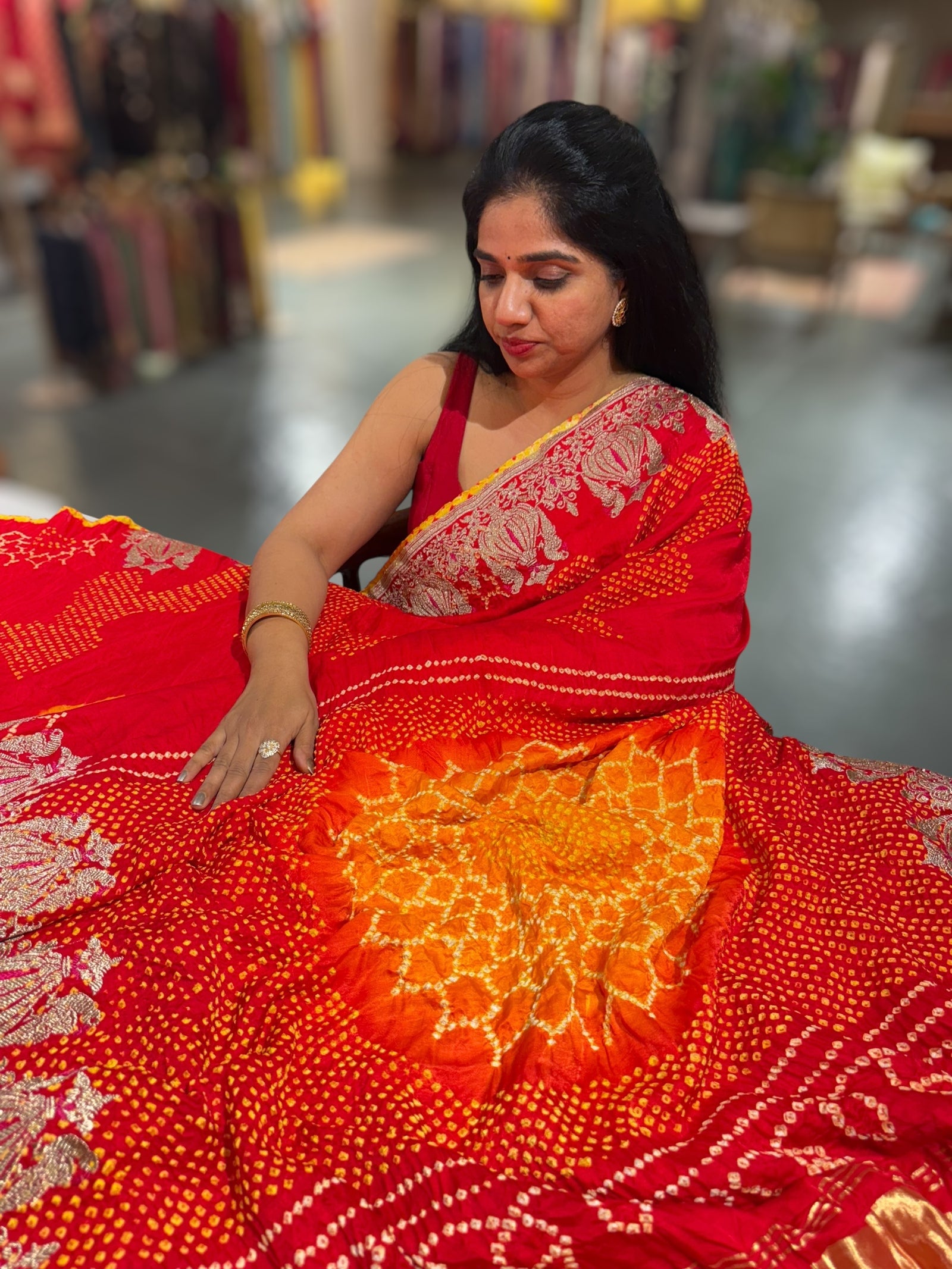 Orangish Red Designer Rai Bandhej Saree With Embroidered Border