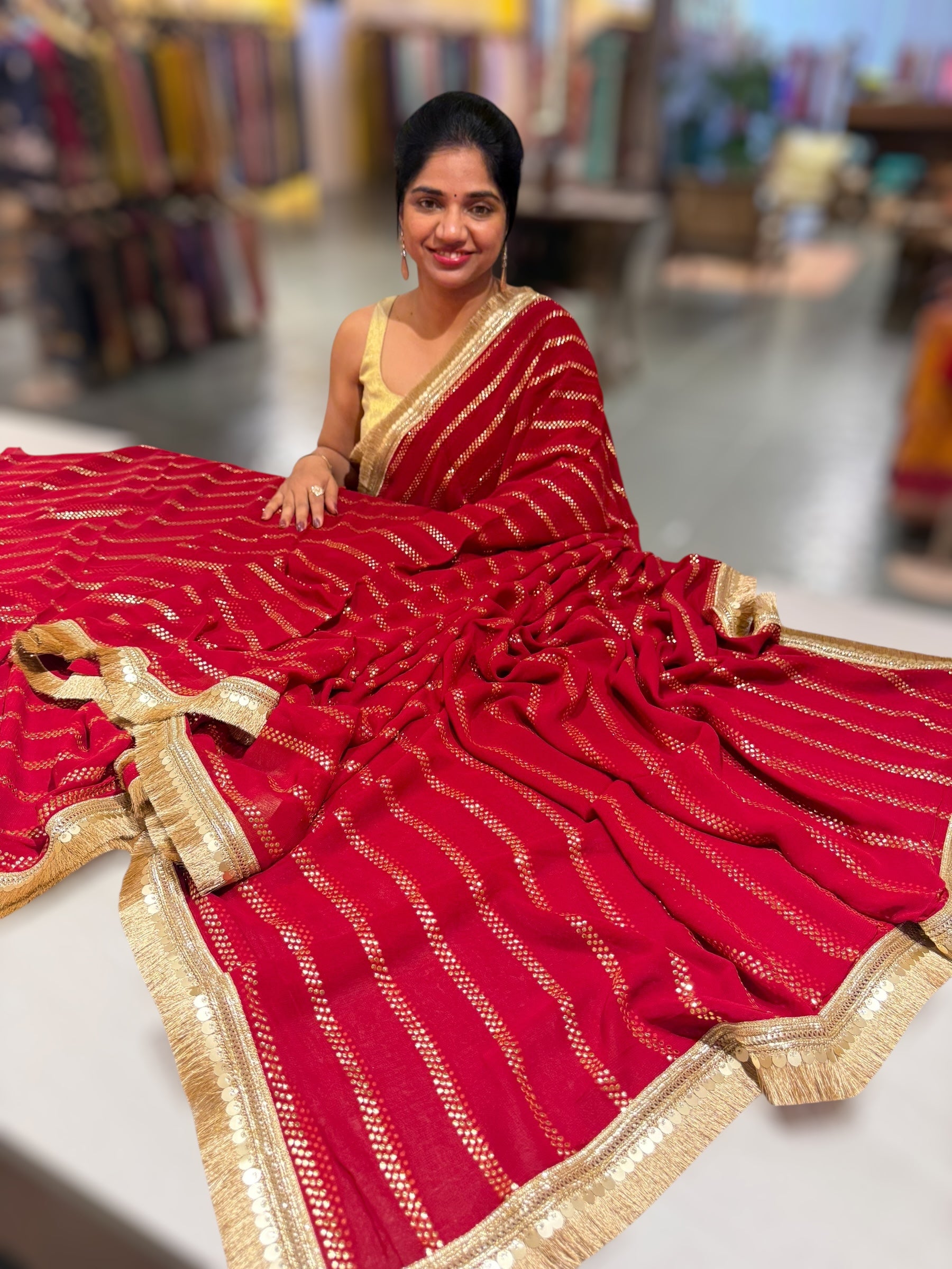 Dark Red Georgette Saree with stick on Badla in stripes pattern and kiran Lace