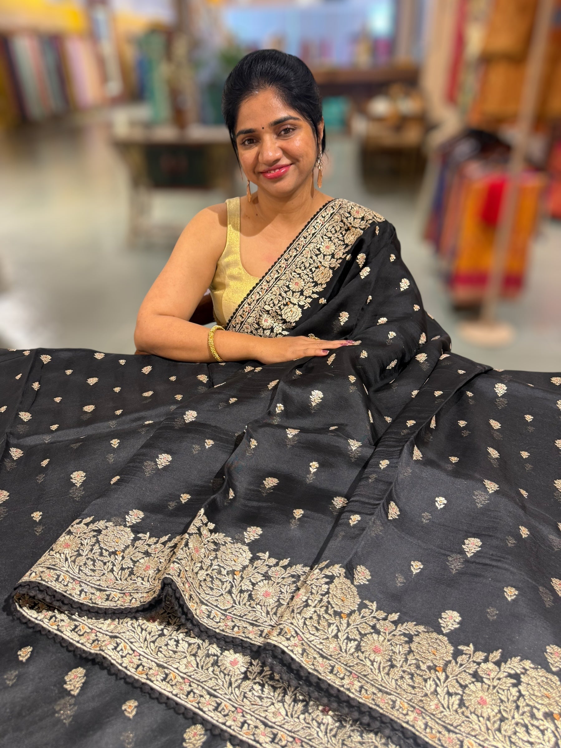 Black Organza Saree with stunning heavy zari embroidered border and alloevr motifs