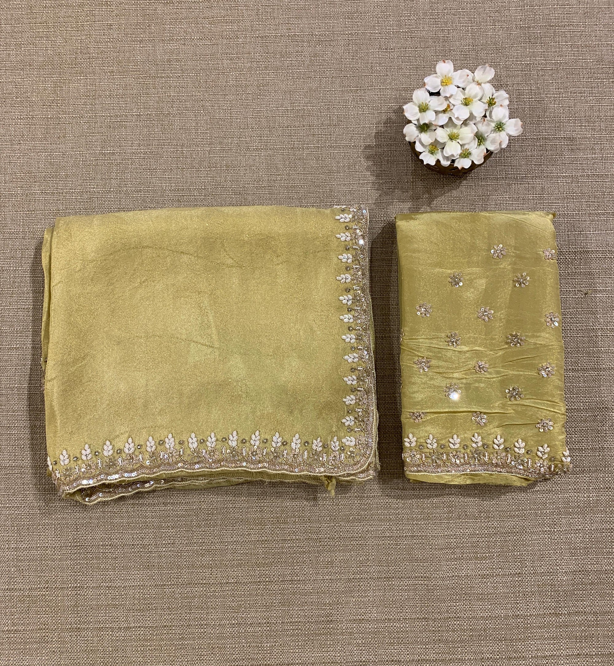 Pastel Yellow Tissue Gorgette Saree With Hanwork Border and Blouse.