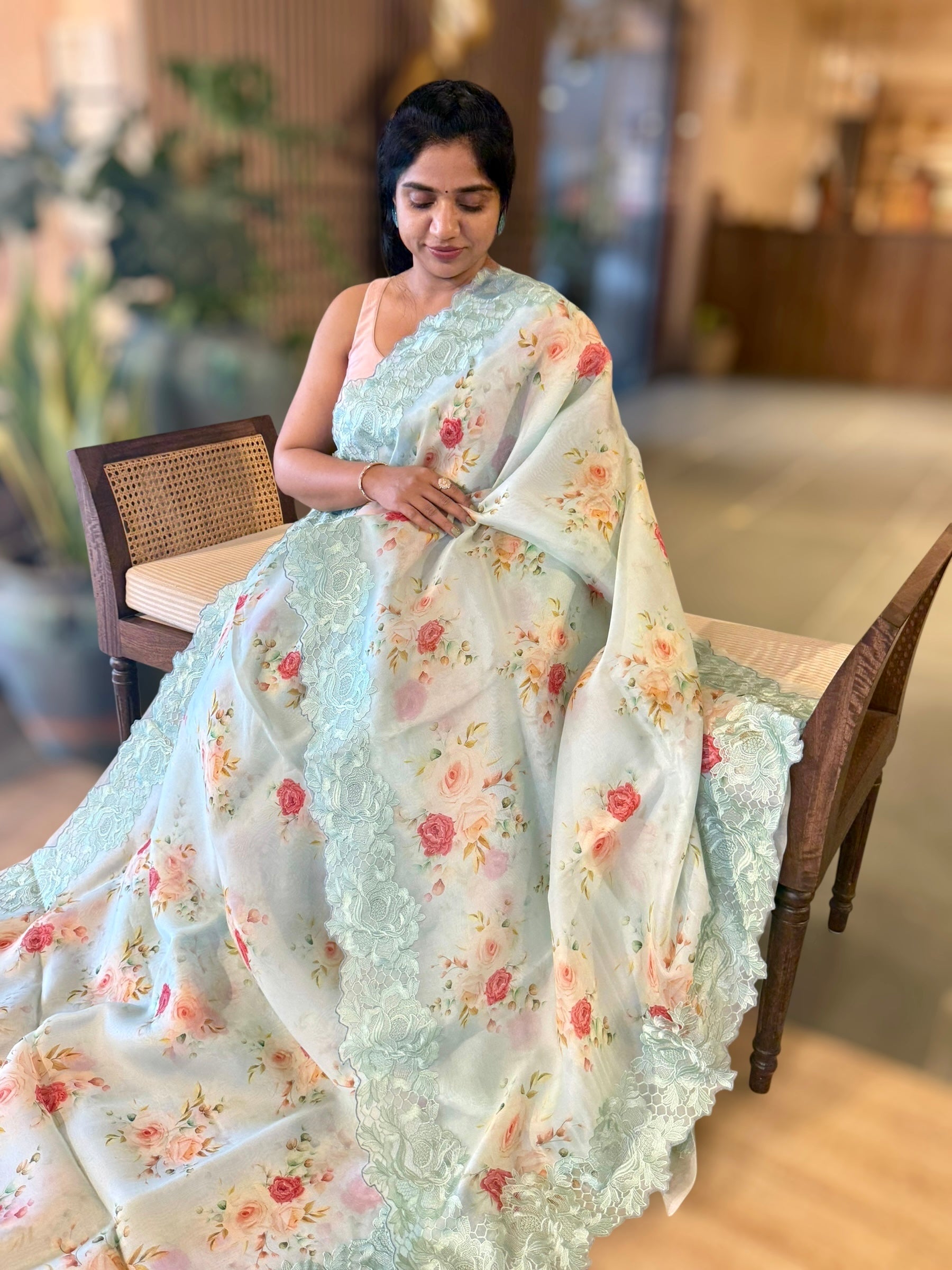 SeaBlue Printed Organza Saree With Chantilly Lace Style Embroidered Border.