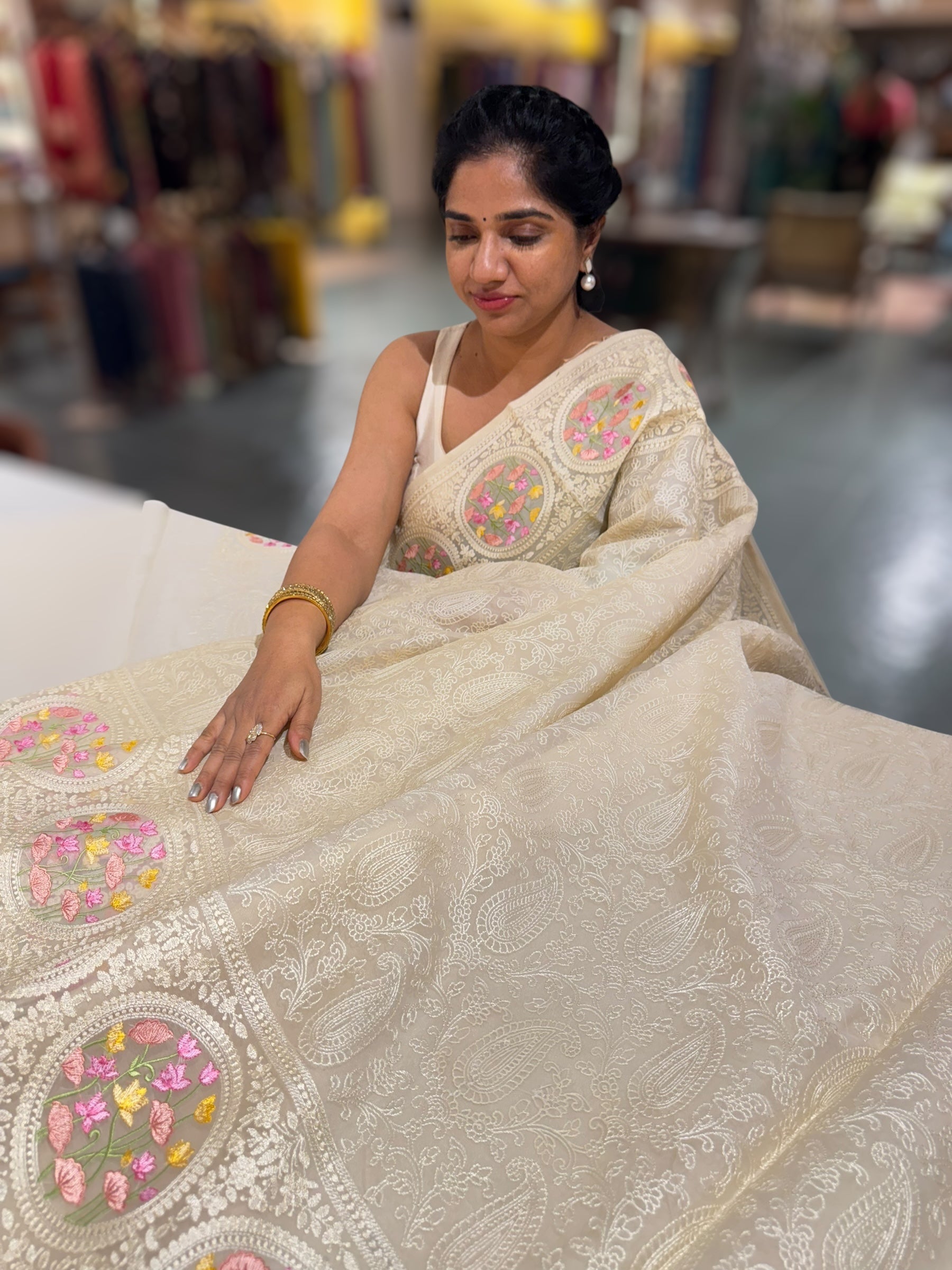 Ivory Organza Saree with allover Chikankari Embroidery and pichwai border