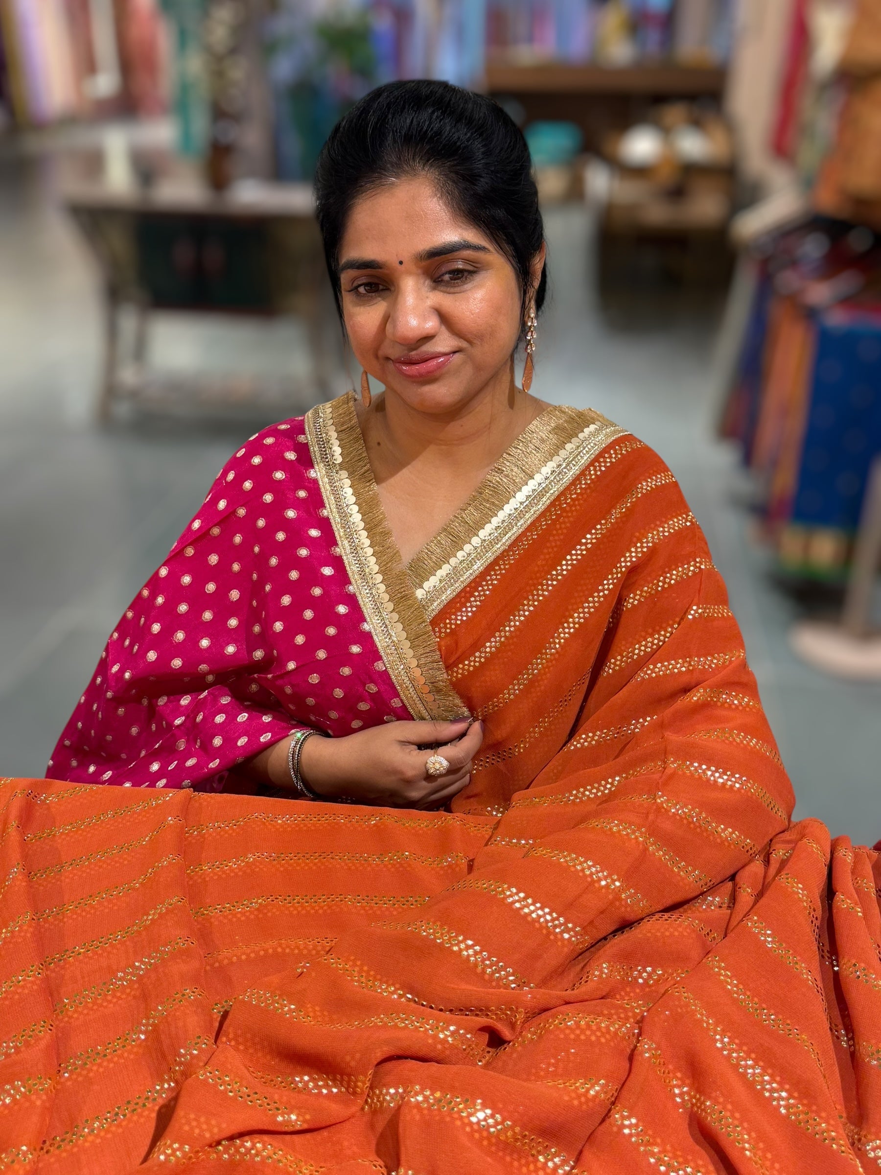 Rust Orange Georgette Saree with stick on Badla in stripes pattern and kiran Lace