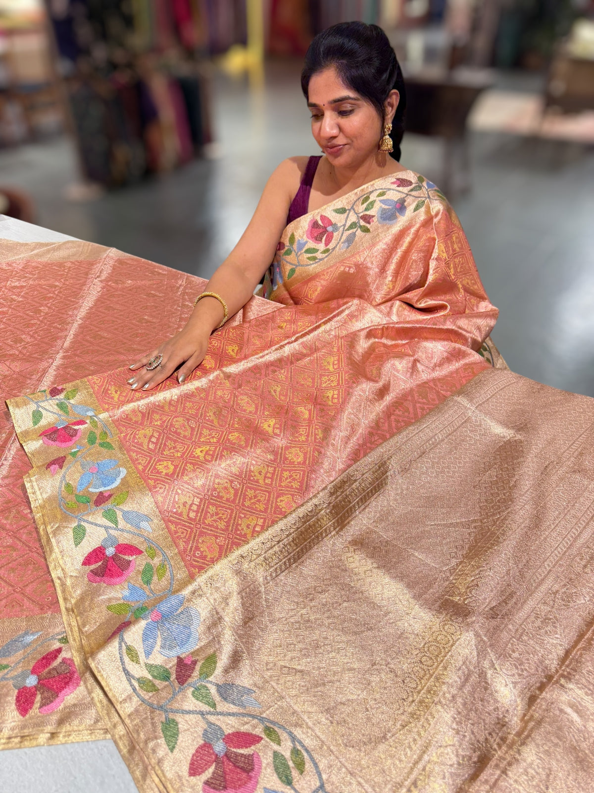 Coral Peach Kanchi Tissue Brocade Saree With jamdani inspired embroidery.
