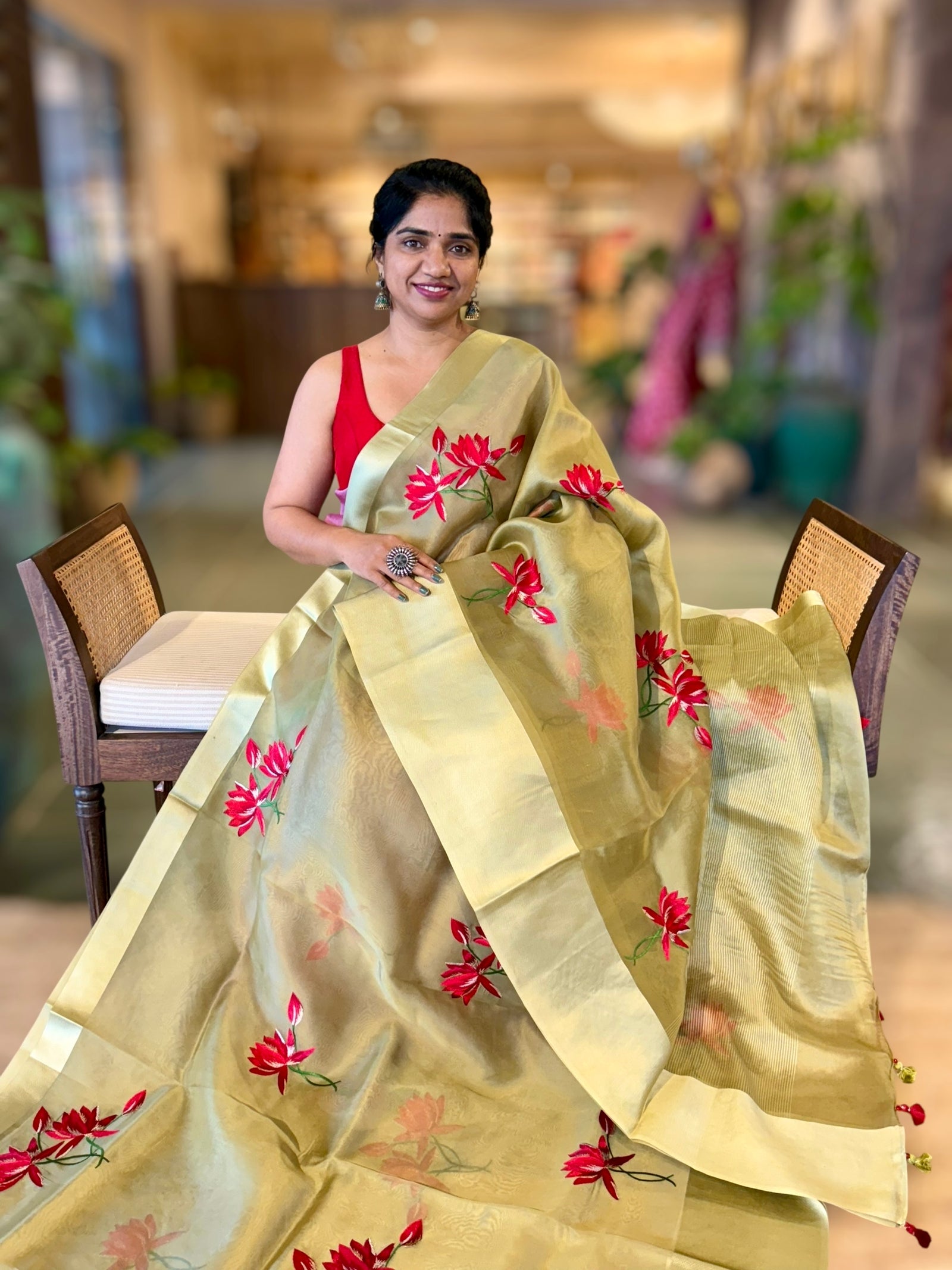 Olive Green Organza Saree with Lotus flower embroidery and Satin Borders.