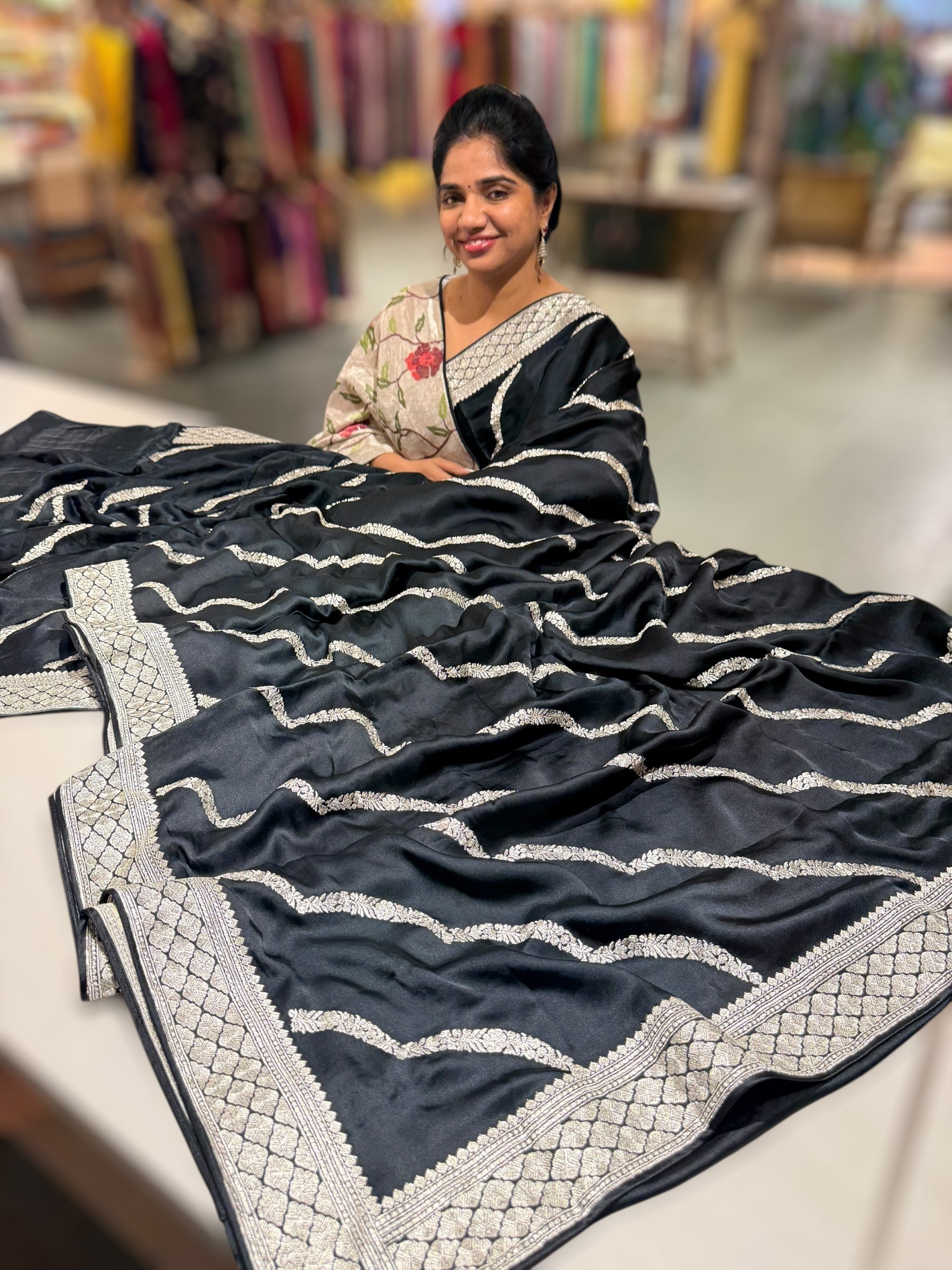 Black Designer Satin Saree with stunning embroidery paired with Silver tissue Pythani embroidered blouse