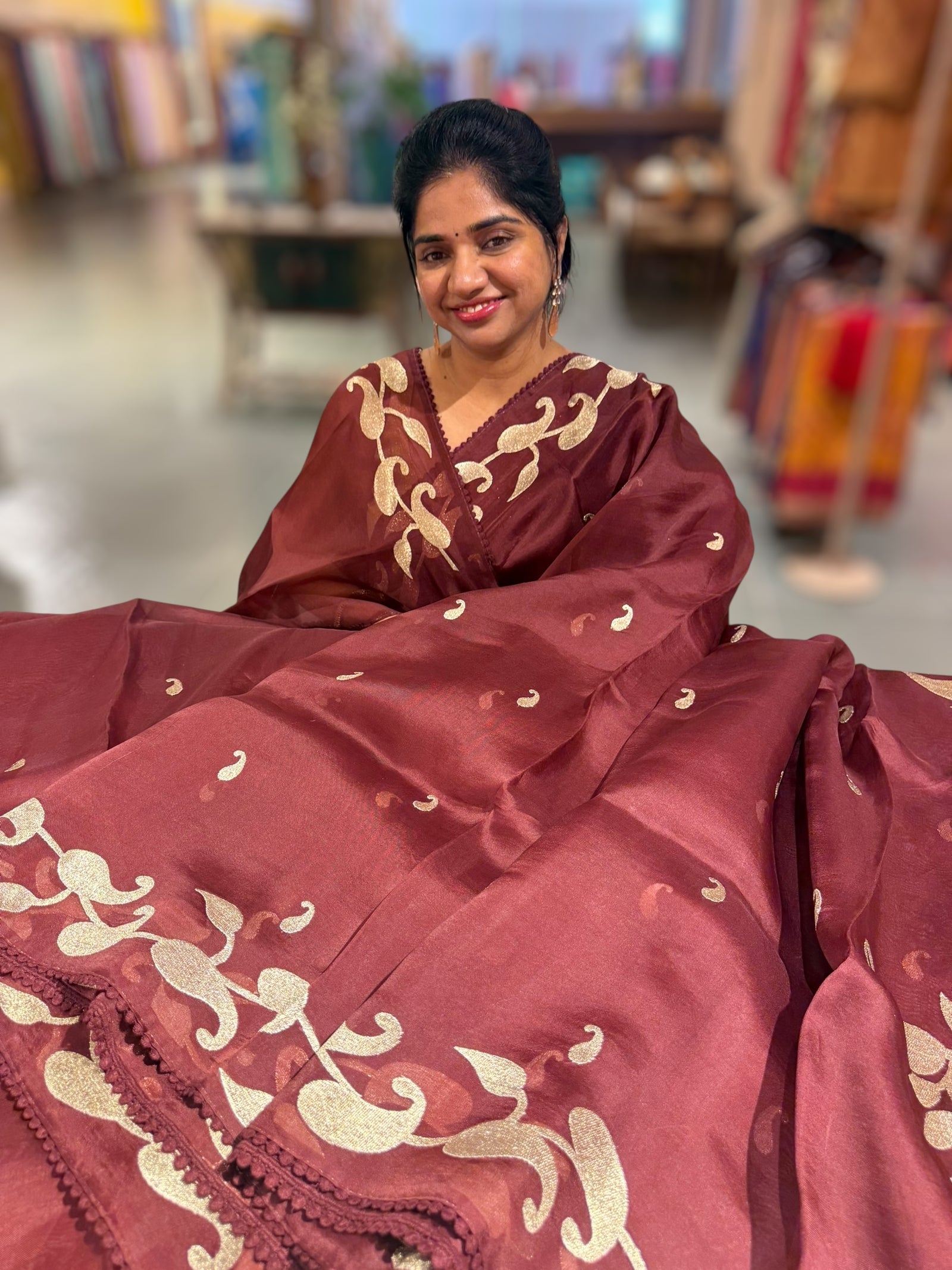 Meroonish Brown Organza Saree with stunning zari embroidered mango border and heavy designer pallu