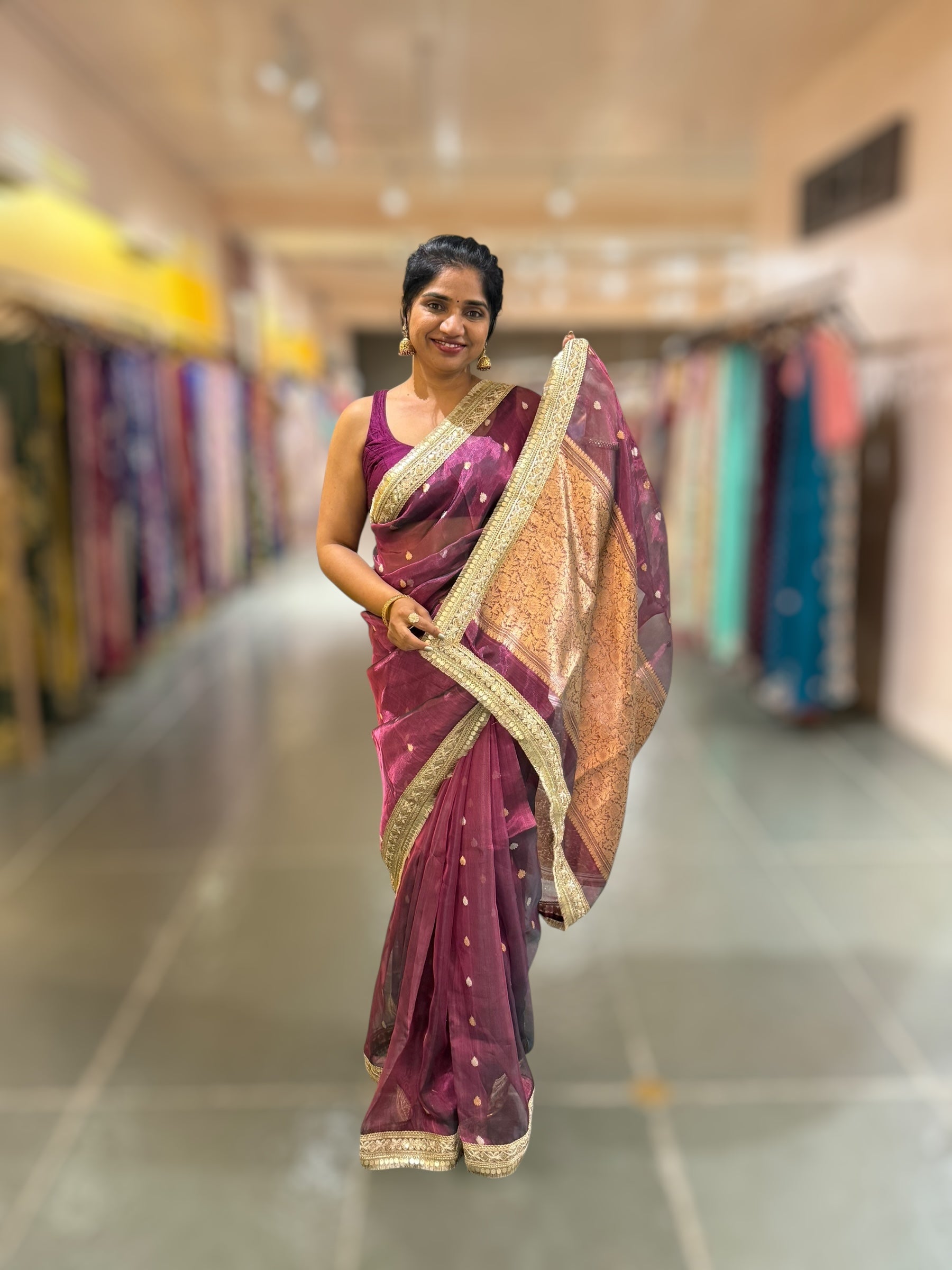Wine Pure handloom Banarasi Tissue saree hemlined with Sabhyasachi style fringe laces .