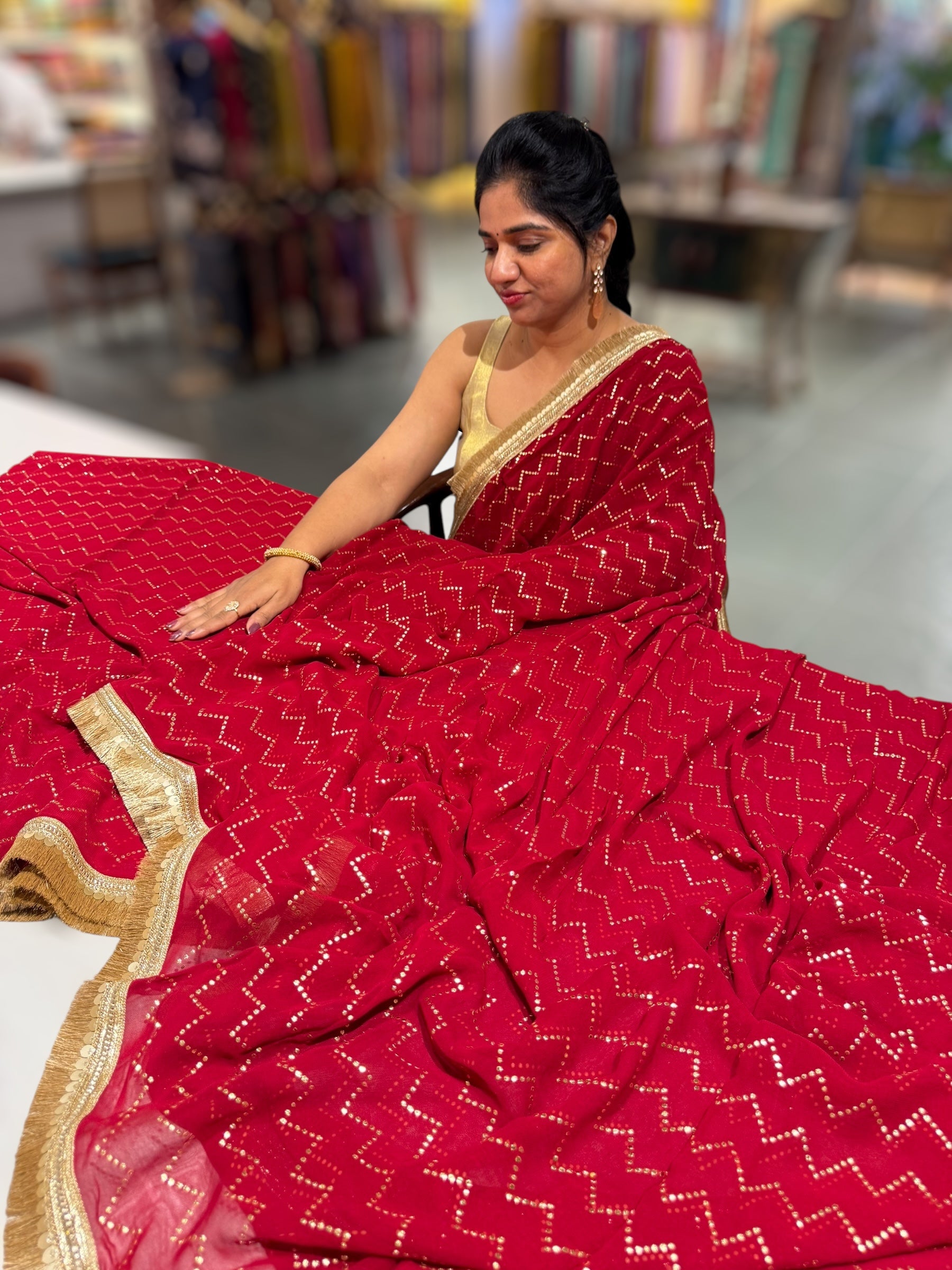 Dark Red Georgette Saree with stick on Badla in zigzag pattern