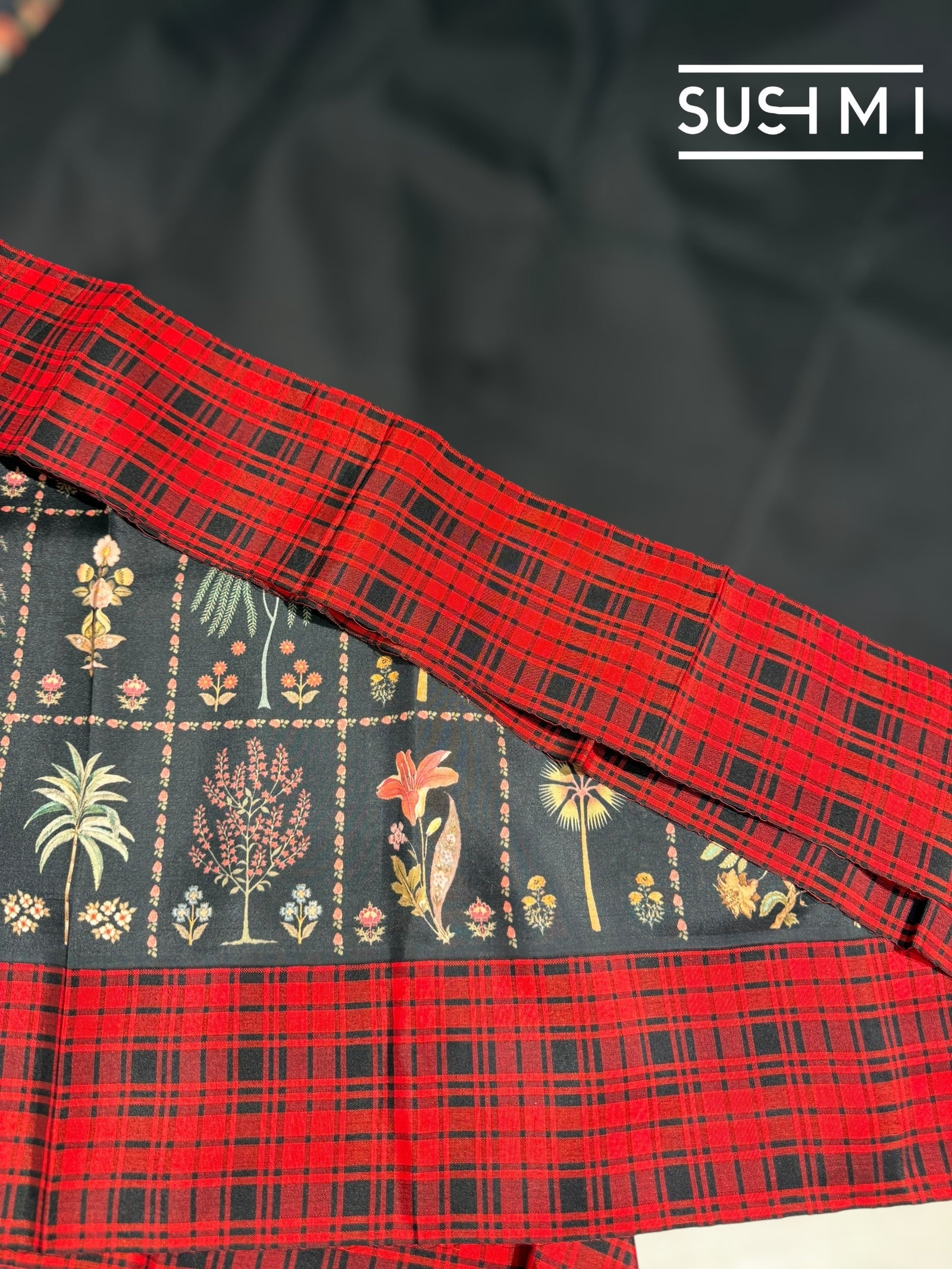 Black printed soft silk saree with burberry checks border : D62F035