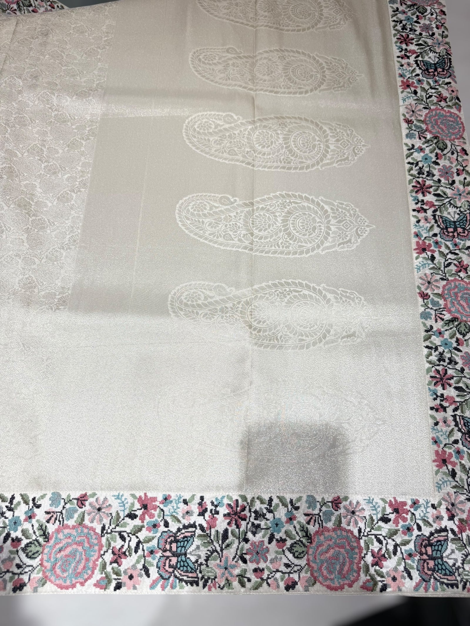 Half White Banarasi brocade Silk Saree with Petite Point Embroidered Border.