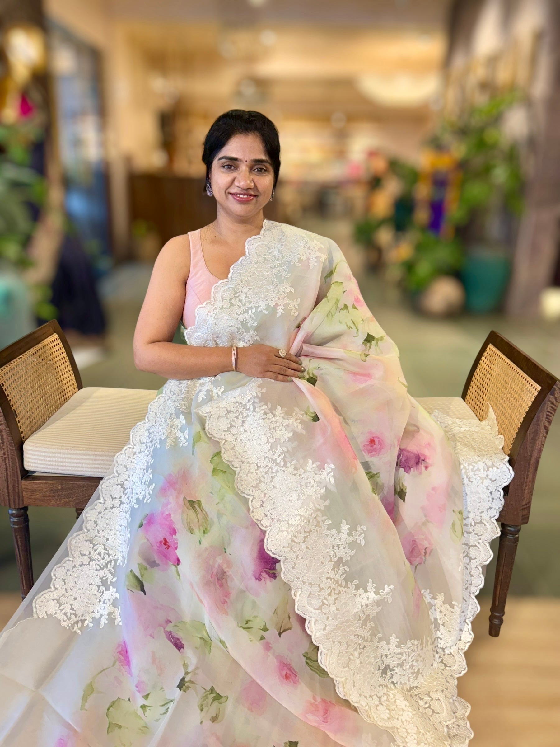 Ivory Printed Organza Saree With Chantilly Lace Style Embroidered Border.