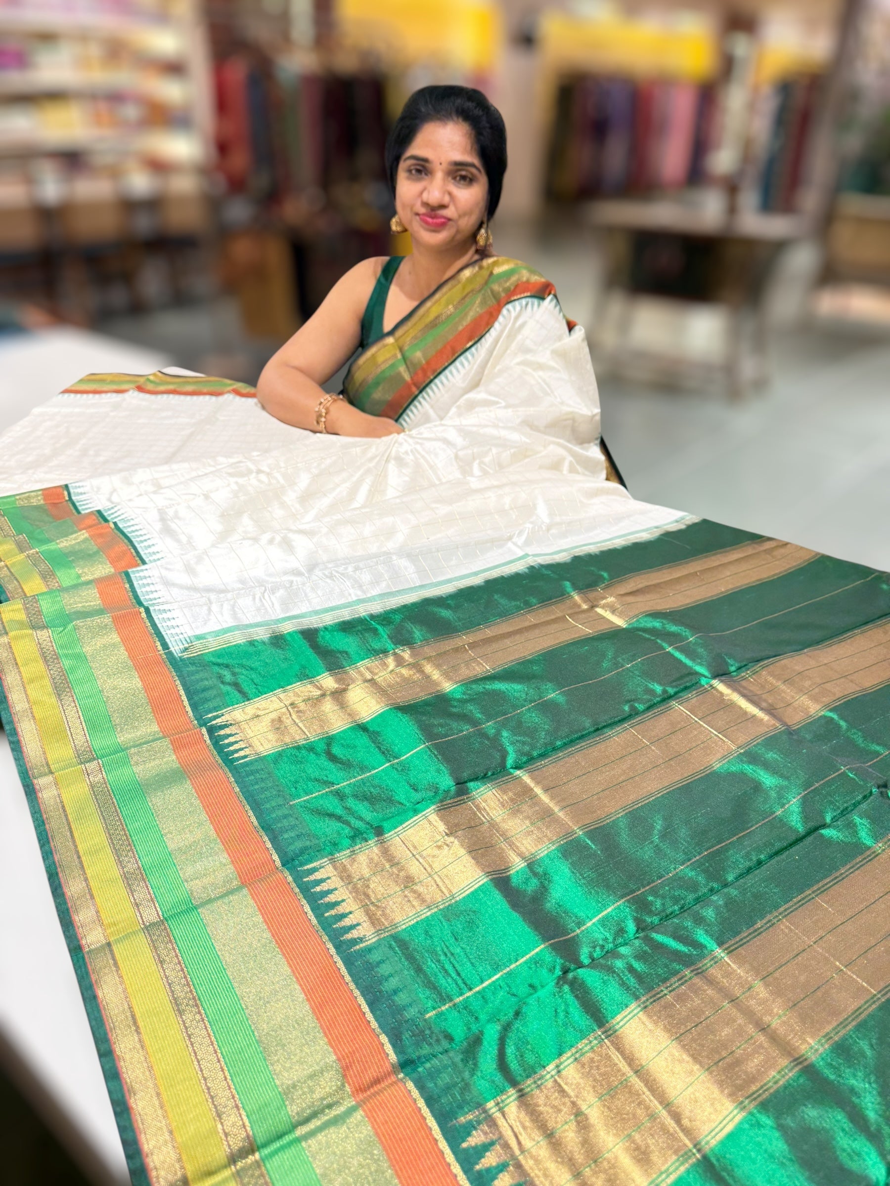 Milk white Kanchi vintage style soft silk saree with zari checks & multi color border.