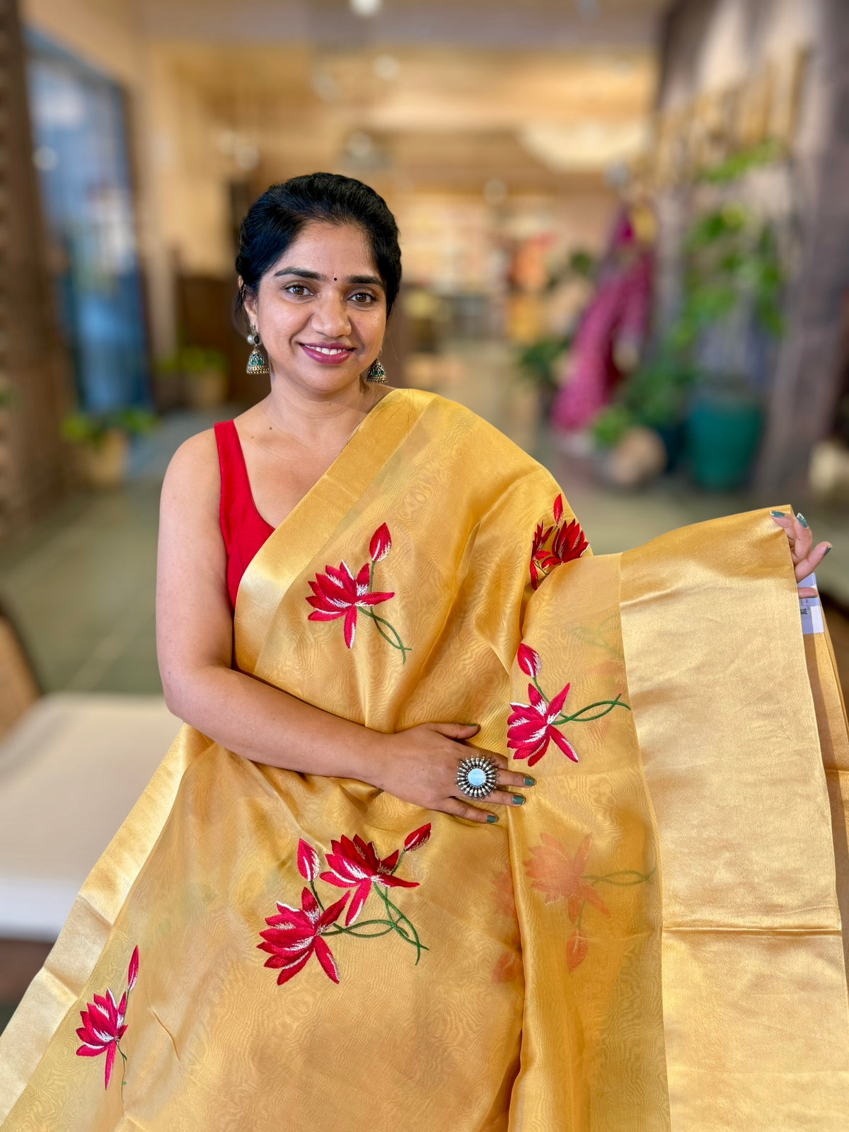 Mustard Organza Saree with Lotus flower embroidery and Satin Borders.