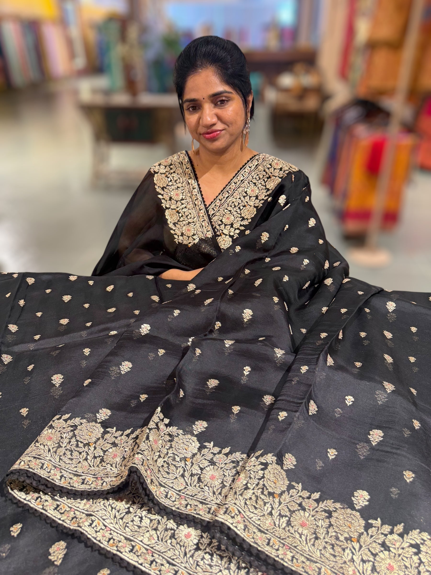 Black Organza Saree with stunning heavy zari embroidered border and alloevr motifs