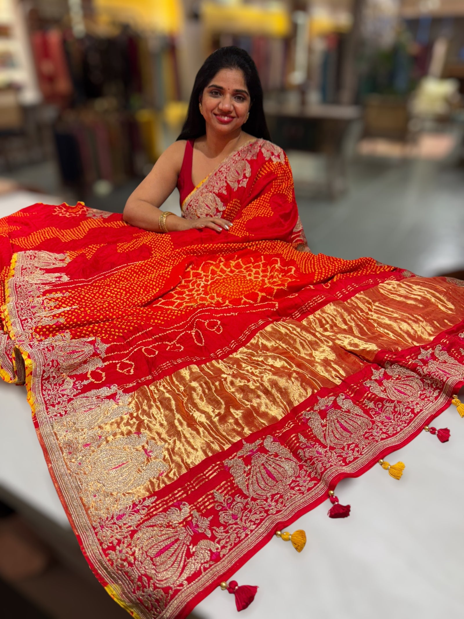Reddish Orange Designer Rai Bandhej Saree With Embroidered Border