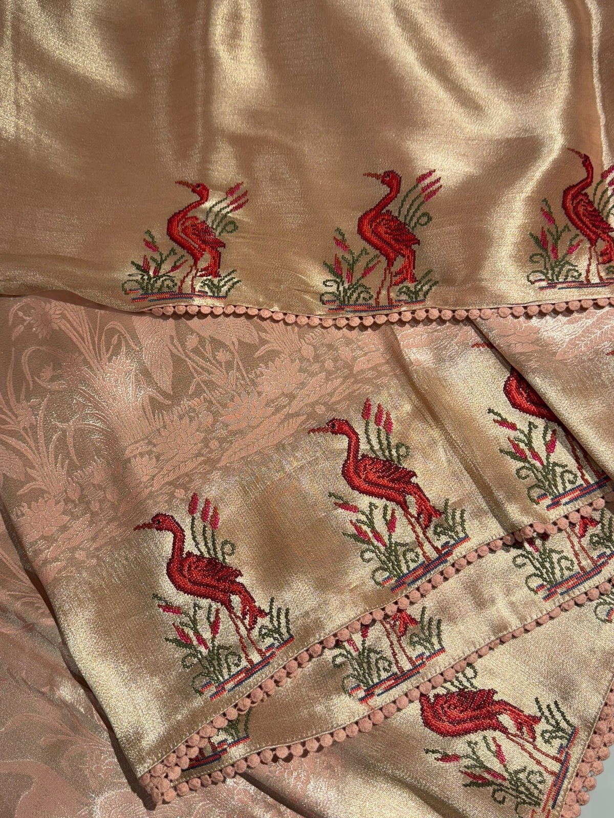 Peach Pink Banarasi Brocade tissue saree with tonchui style weaving & petite point embroidered swan border