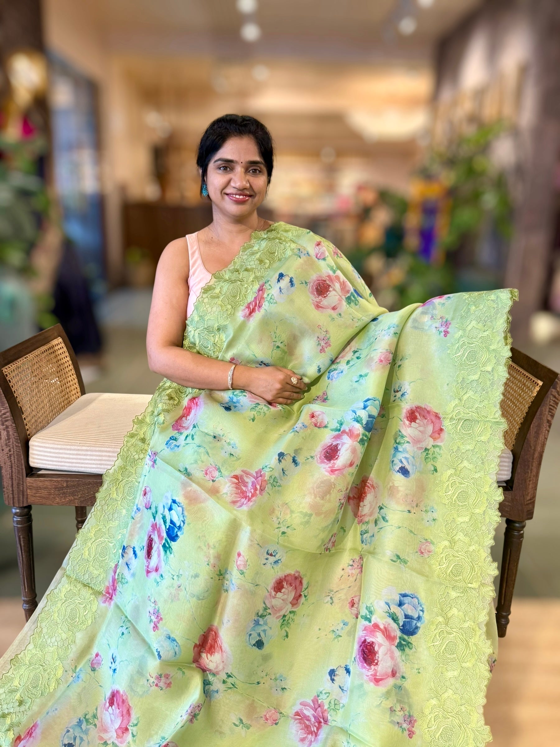 Parrot Green Printed Organza Saree With Chantilly Lace Style Embroidered Border.