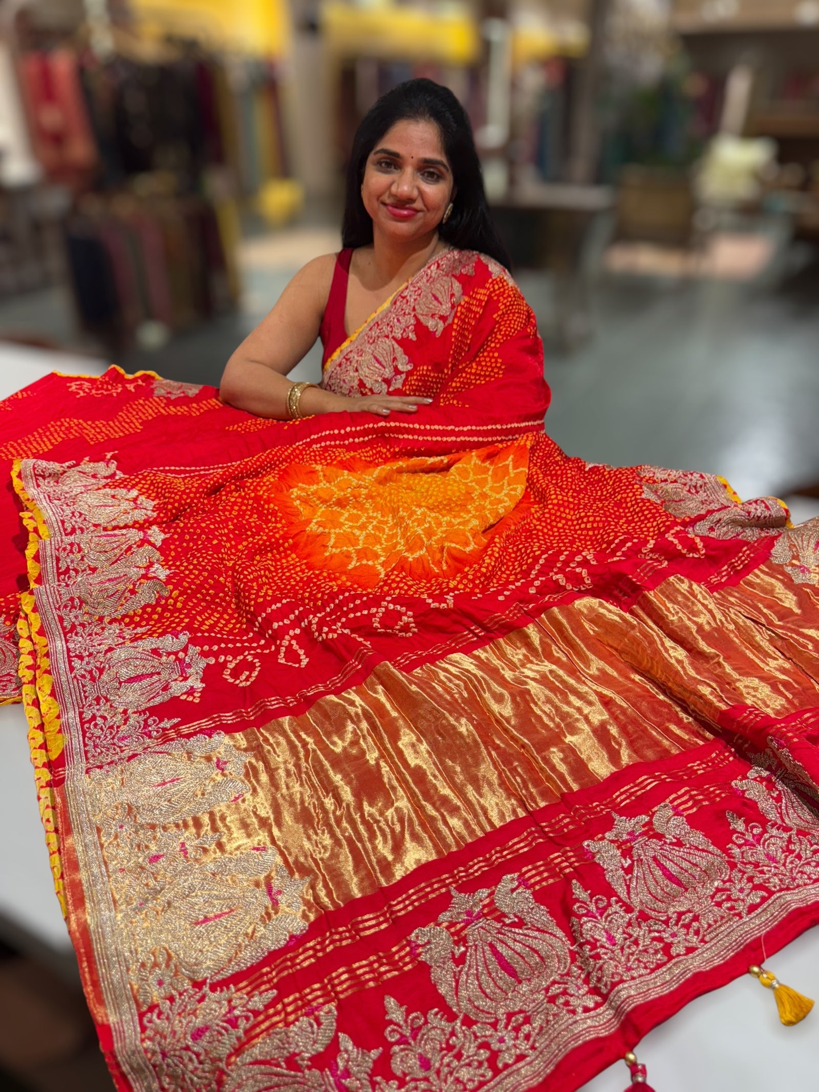 Orangish Red Designer Rai Bandhej Saree With Embroidered Border