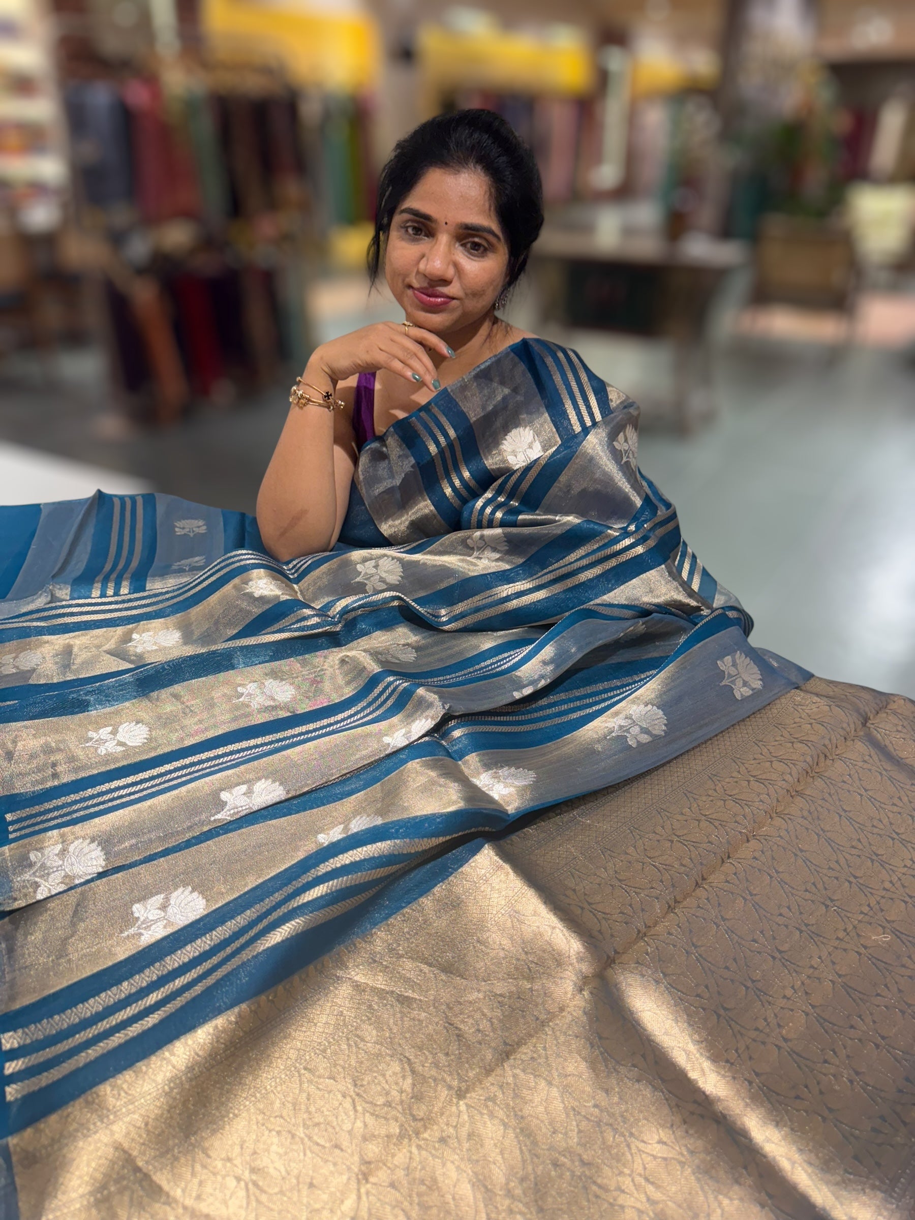 Peacock Blue Banarasi Handloom Kora Tissue Stripes with allover kaduwa woven lotus  motifs .
