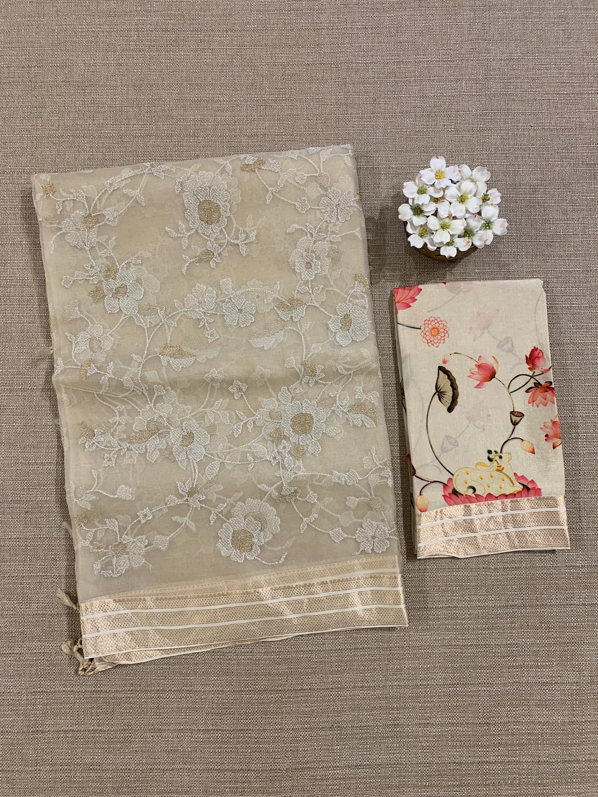 Beige Muslin allover embroidered Saree with pichwai printed blosue