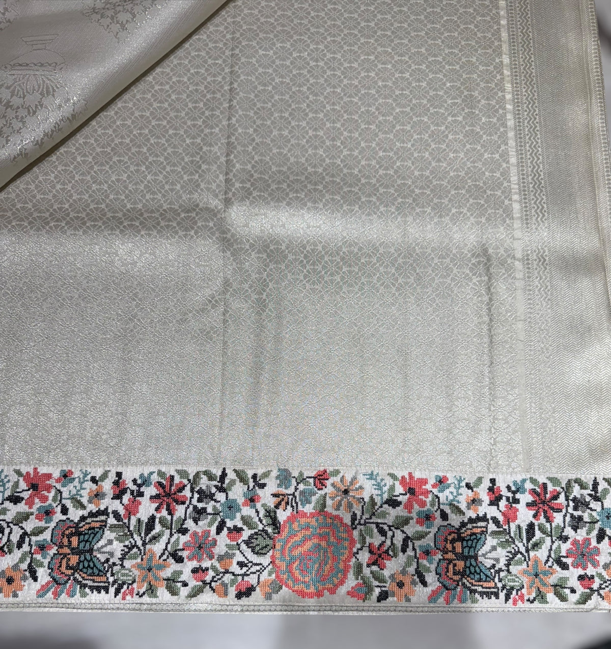 Half White Banarasi  brocade Silk Saree with Petite Point Embroidered Border.