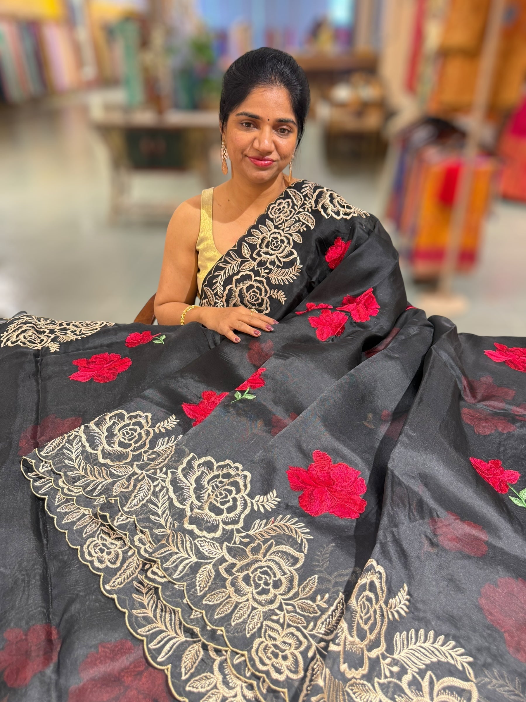 Black Organza Saree with stunning outline floral embroidered cytwork border and red hibuscus flowers allover