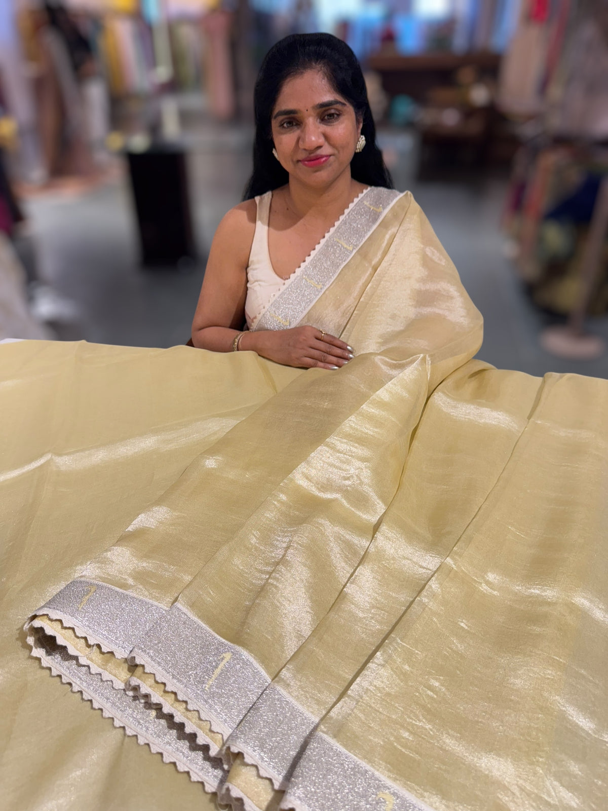 Pastel yellow Tissue Saree with pythani tissue embroidered border