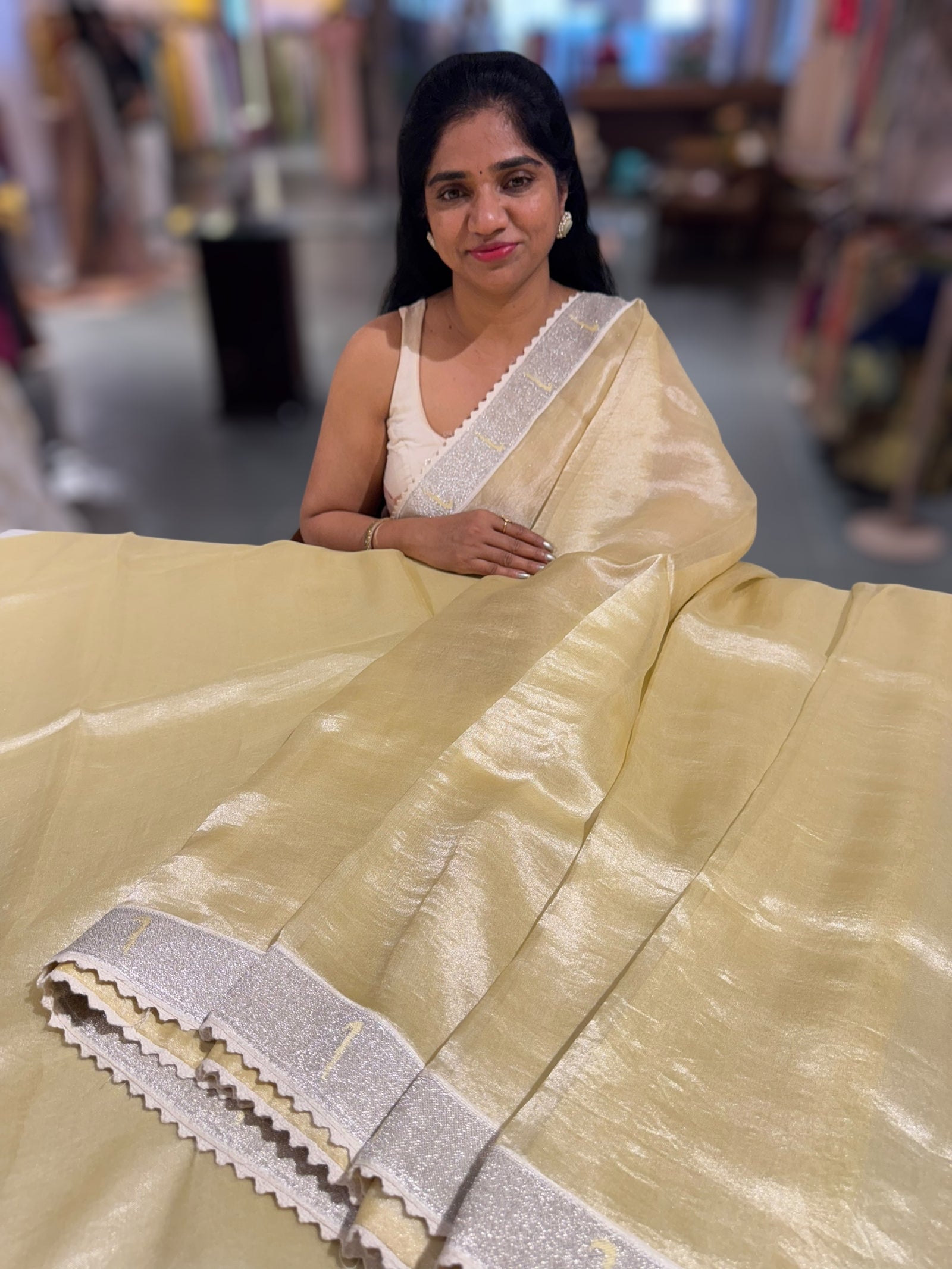 Pastel yellow Tissue Saree with pythani tissue embroidered border